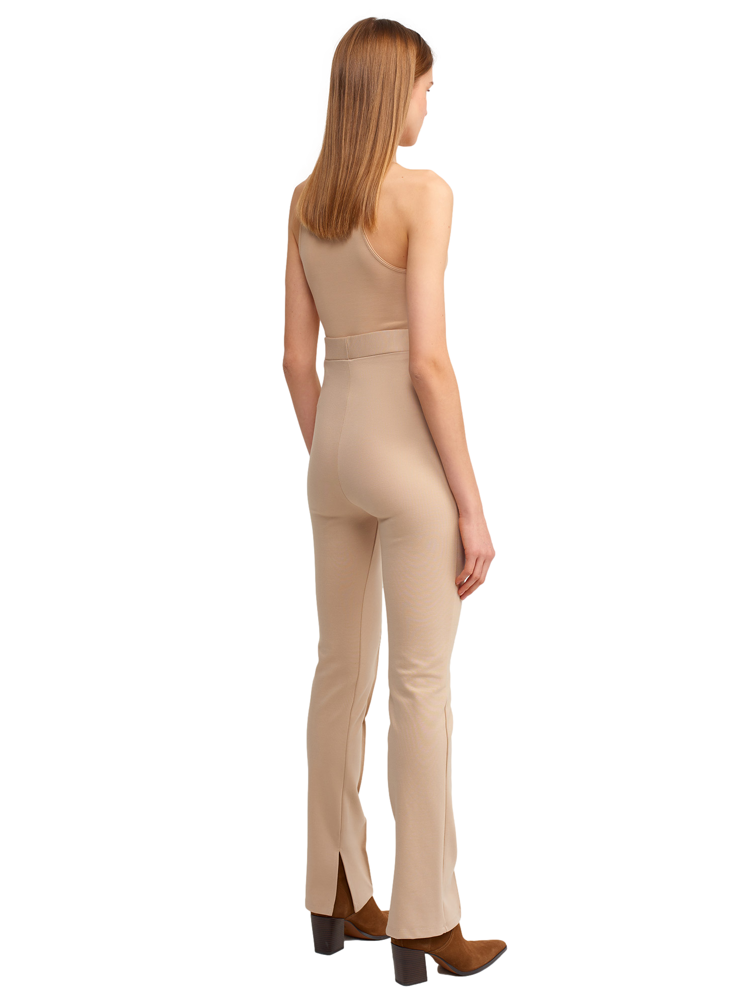 A pair of stylish knitted trousers featuring a slit detail, showcasing a soft fabric blend of viscose, nylon, and elastane.