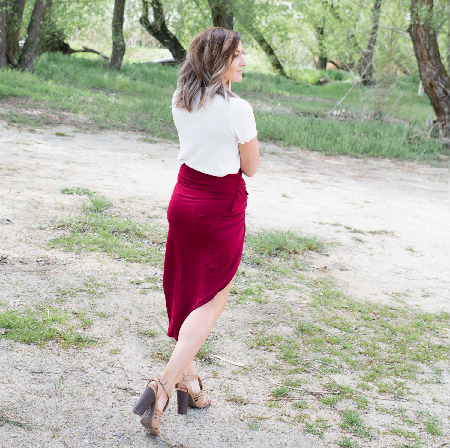 A stylish Knotted Tulip Skirt featuring a front knot design, showcasing a sleek silhouette and stretchy fabric, perfect for spring and summer wear.