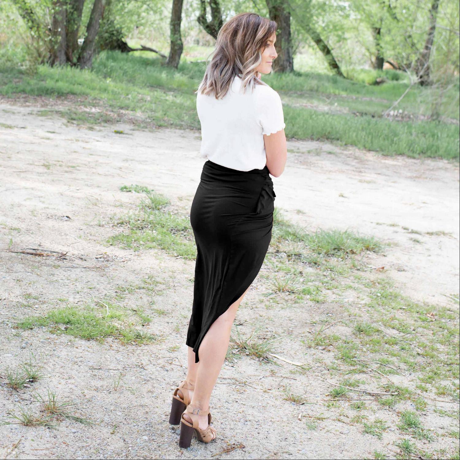 A stylish Knotted Tulip Skirt featuring a front knot design, showcasing a sleek silhouette and stretchy fabric, perfect for spring and summer wear.