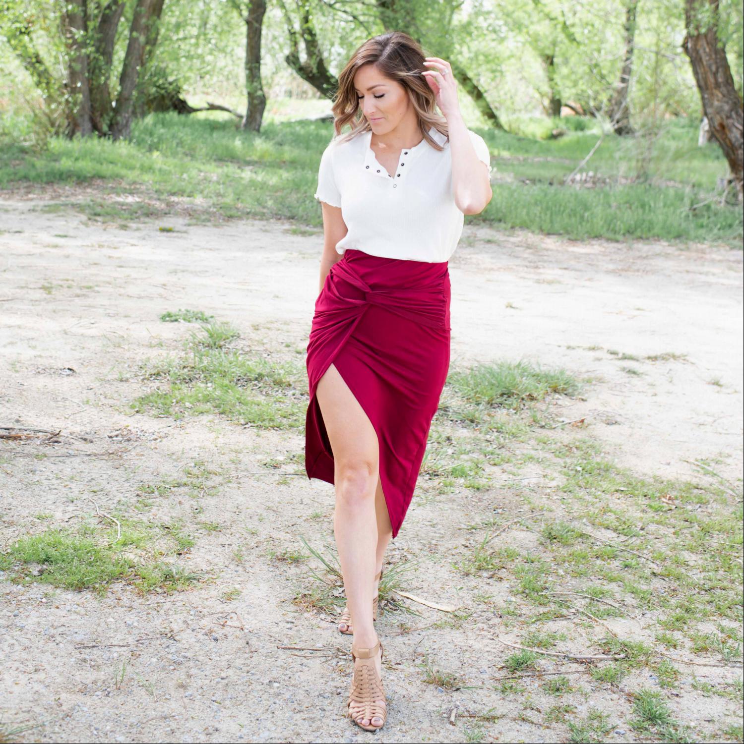 A stylish Knotted Tulip Skirt featuring a front knot design, showcasing a sleek silhouette and stretchy fabric, perfect for spring and summer wear.