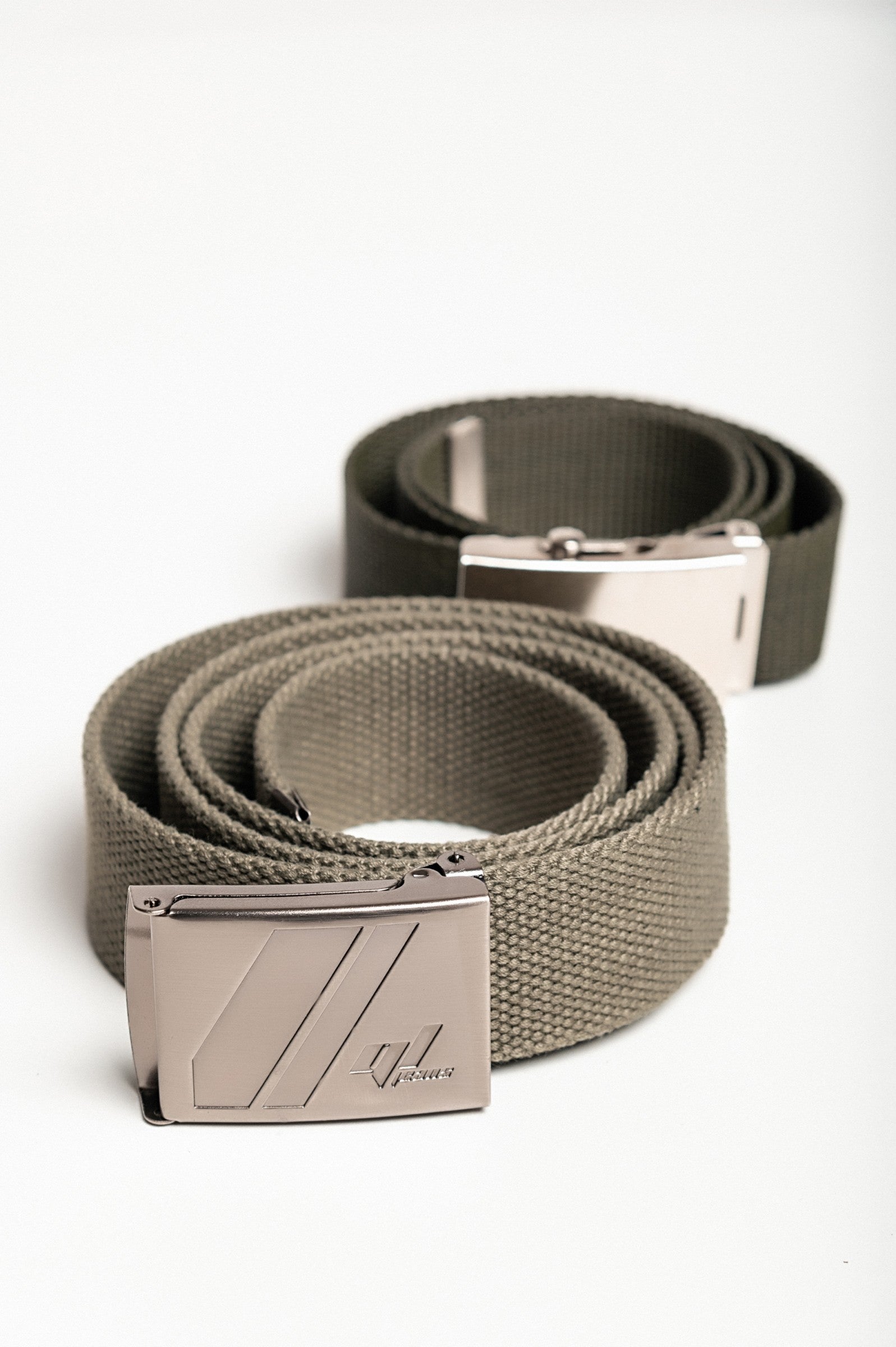 Two-piece belt set in green and olive with metal buckle, showcasing adjustable lengths and durable polyester material.