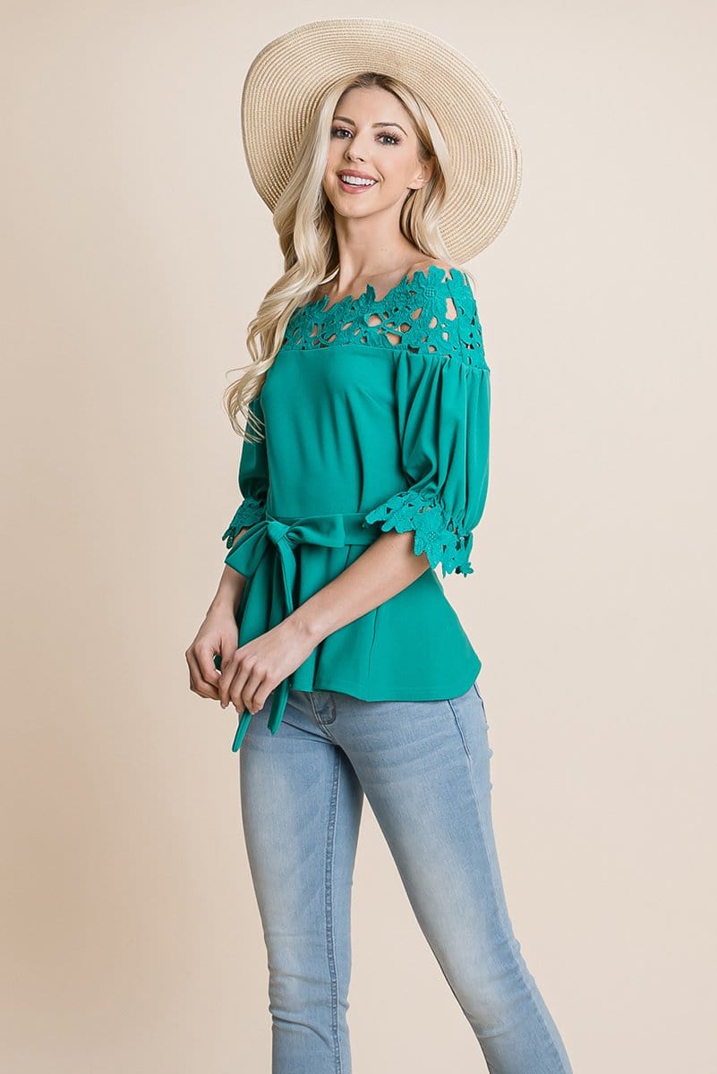 A stylish Lace Crochet Self Belted Off The Shoulder Top featuring floral lace applique, half lace trim sleeves, and a hidden back zipper.