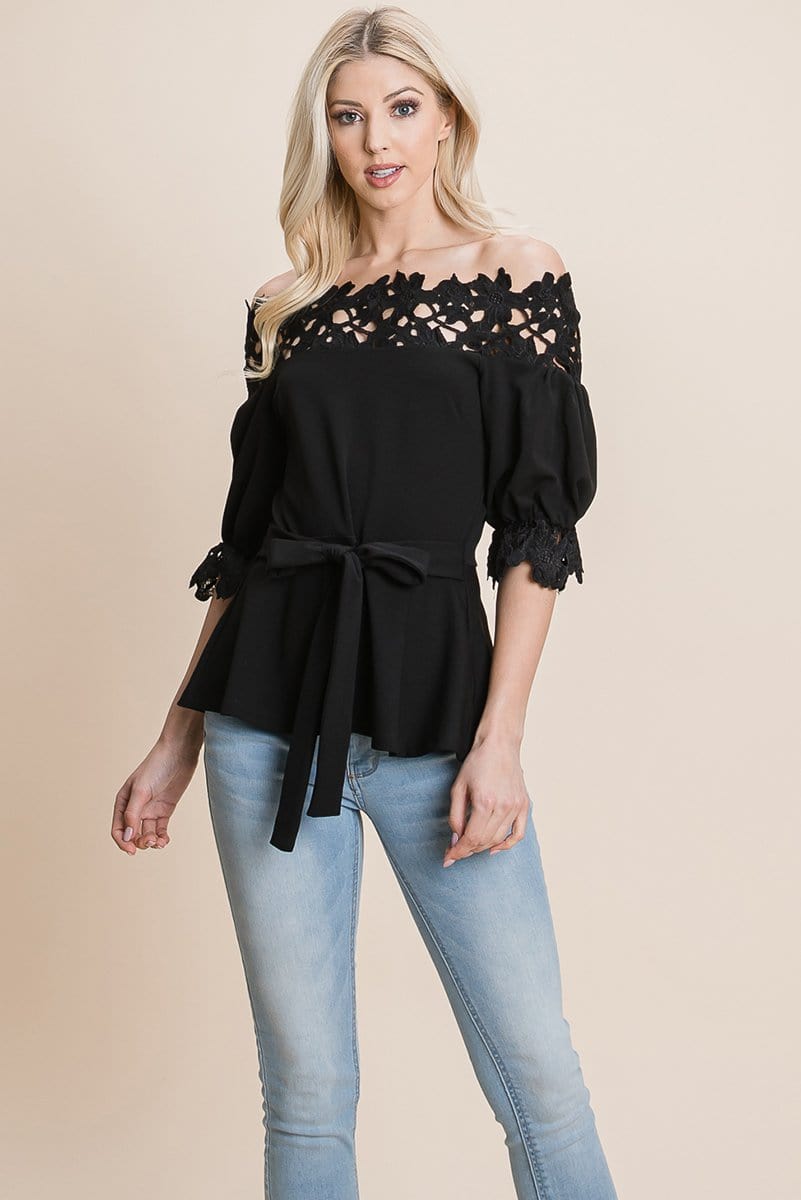 A stylish Lace Crochet Self Belted Off The Shoulder Top featuring floral lace applique, half lace trim sleeves, and a hidden back zipper.