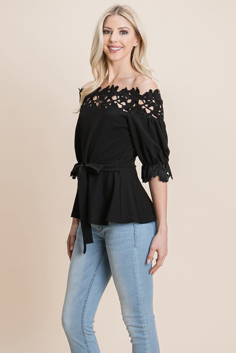 A stylish Lace Crochet Self Belted Off The Shoulder Top featuring floral lace applique, half lace trim sleeves, and a hidden back zipper.