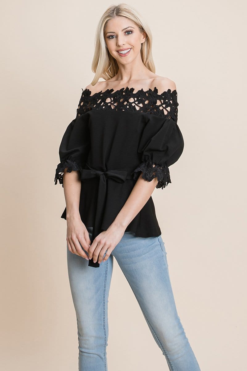 A stylish Lace Crochet Self Belted Off The Shoulder Top featuring floral lace applique, half lace trim sleeves, and a hidden back zipper.