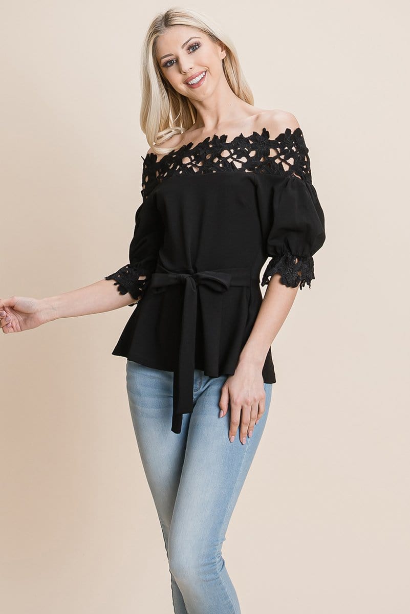 A stylish Lace Crochet Self Belted Off The Shoulder Top featuring floral lace applique, half lace trim sleeves, and a hidden back zipper.