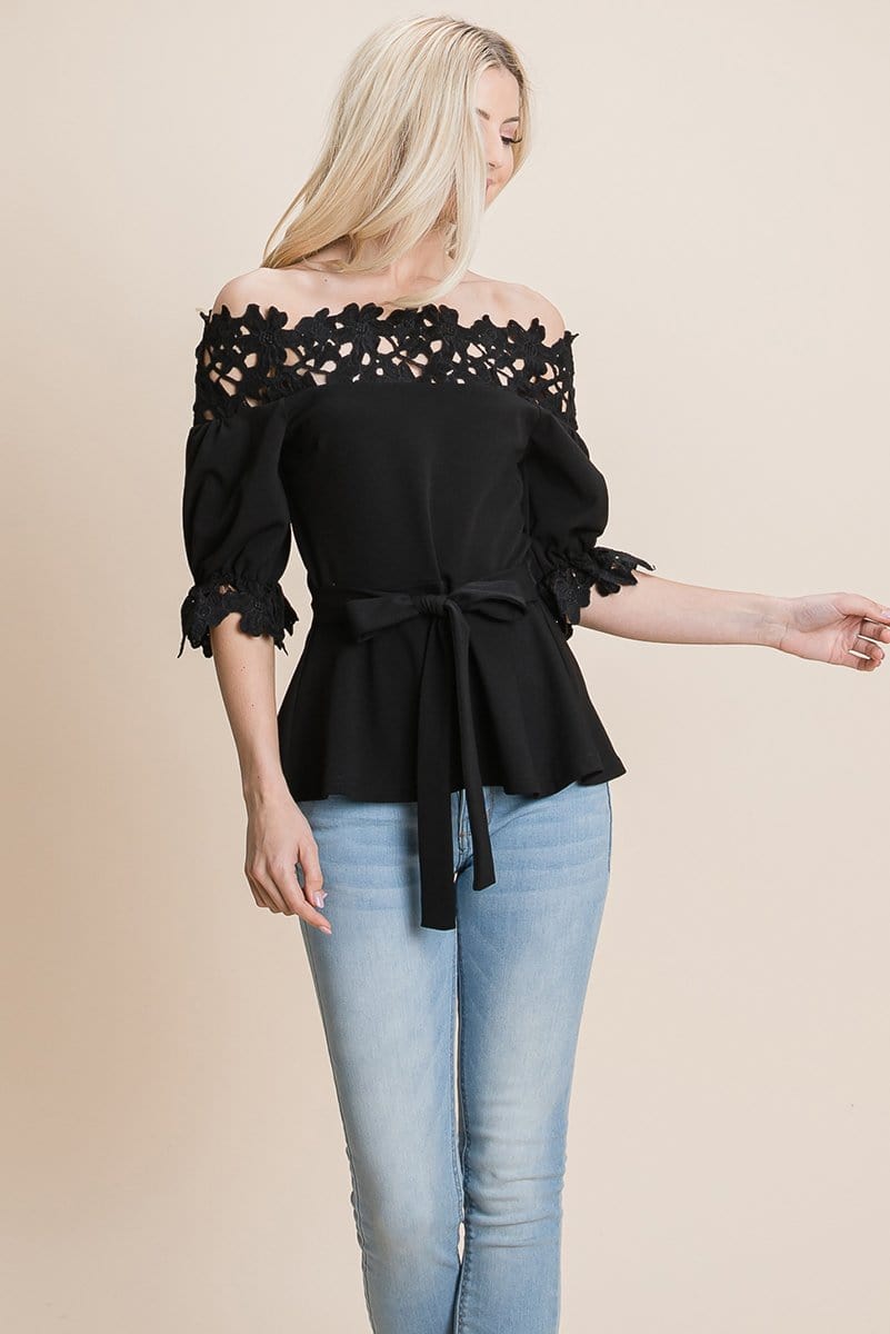 A stylish Lace Crochet Self Belted Off The Shoulder Top featuring floral lace applique, half lace trim sleeves, and a hidden back zipper.