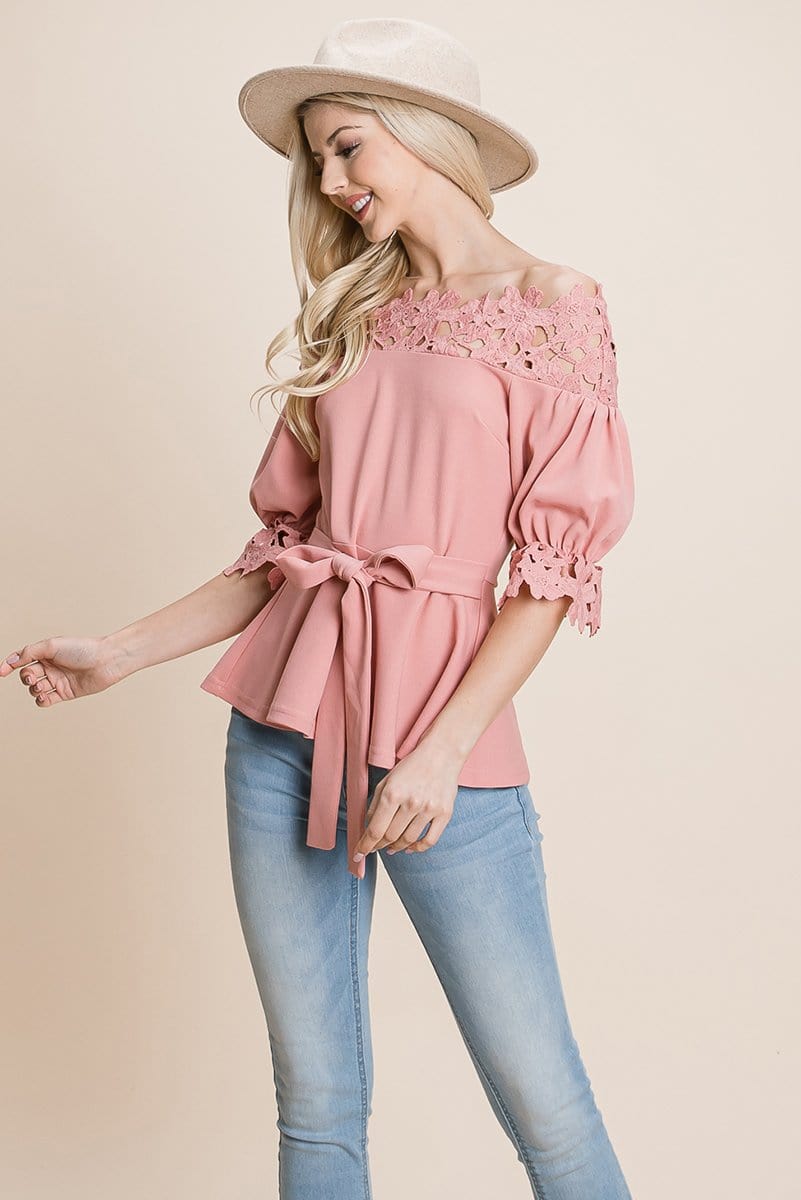 A stylish Lace Crochet Self Belted Off The Shoulder Top featuring floral lace applique, half lace trim sleeves, and a hidden back zipper.