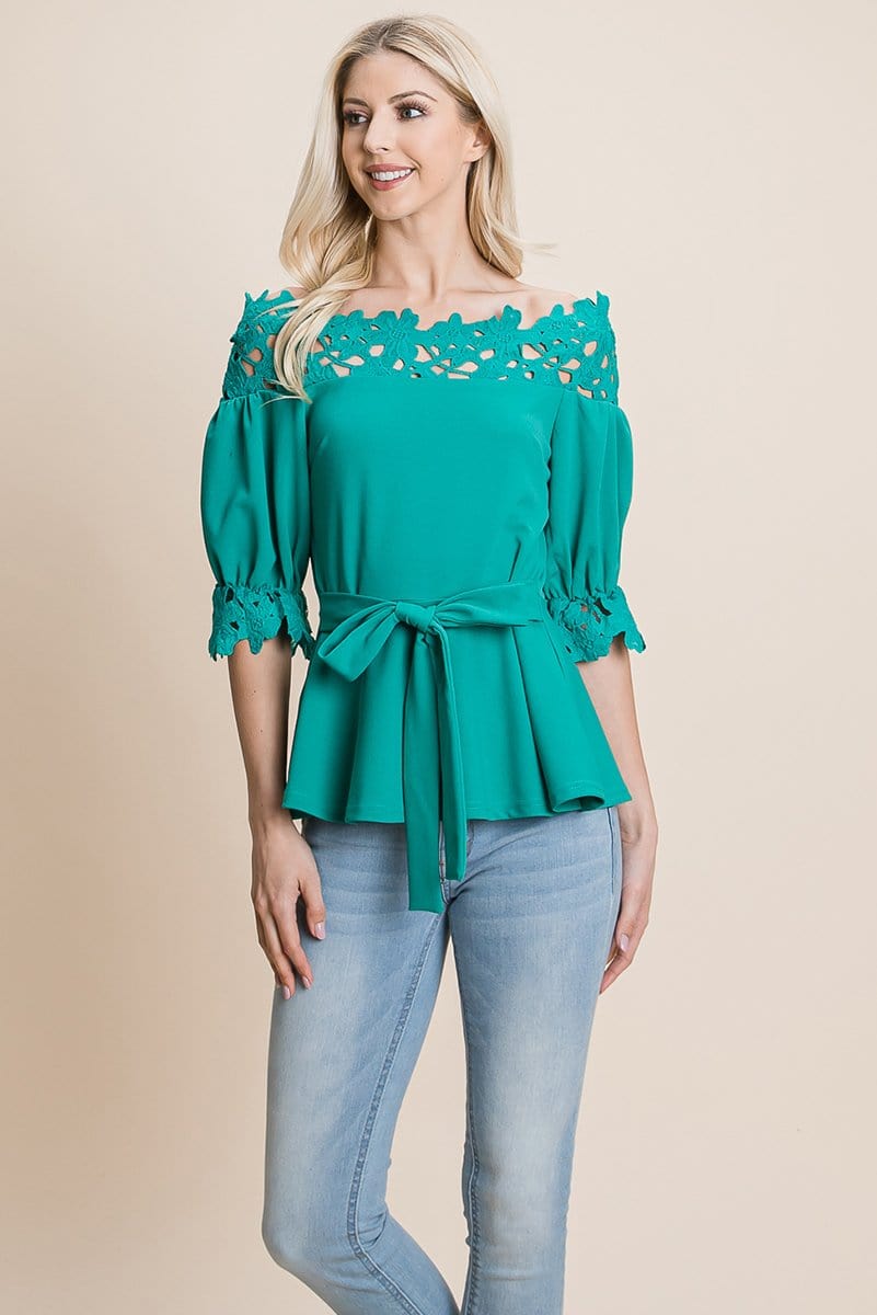 A stylish Lace Crochet Self Belted Off The Shoulder Top featuring floral lace applique, half lace trim sleeves, and a hidden back zipper.