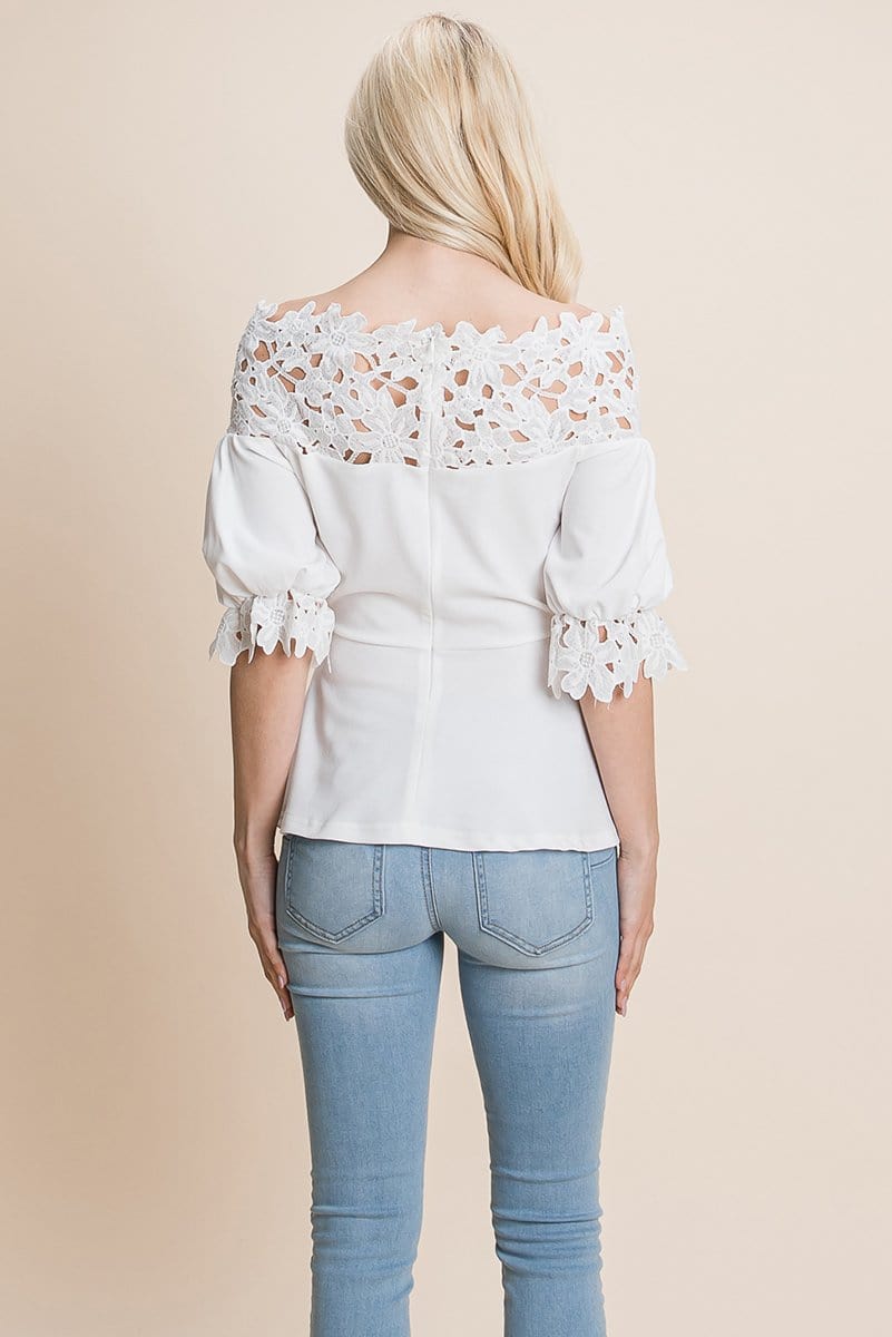 A stylish Lace Crochet Self Belted Off The Shoulder Top featuring floral lace applique, half lace trim sleeves, and a hidden back zipper.