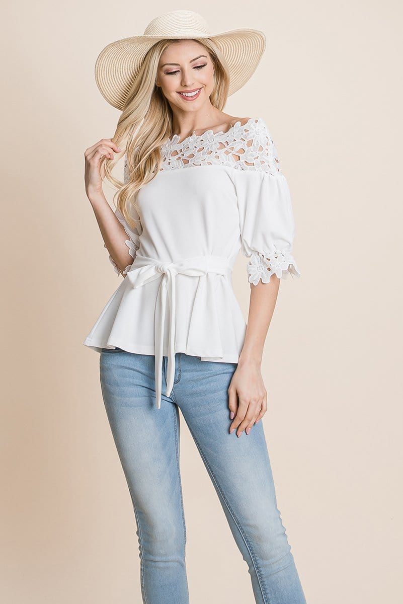 A stylish Lace Crochet Self Belted Off The Shoulder Top featuring floral lace applique, half lace trim sleeves, and a hidden back zipper.