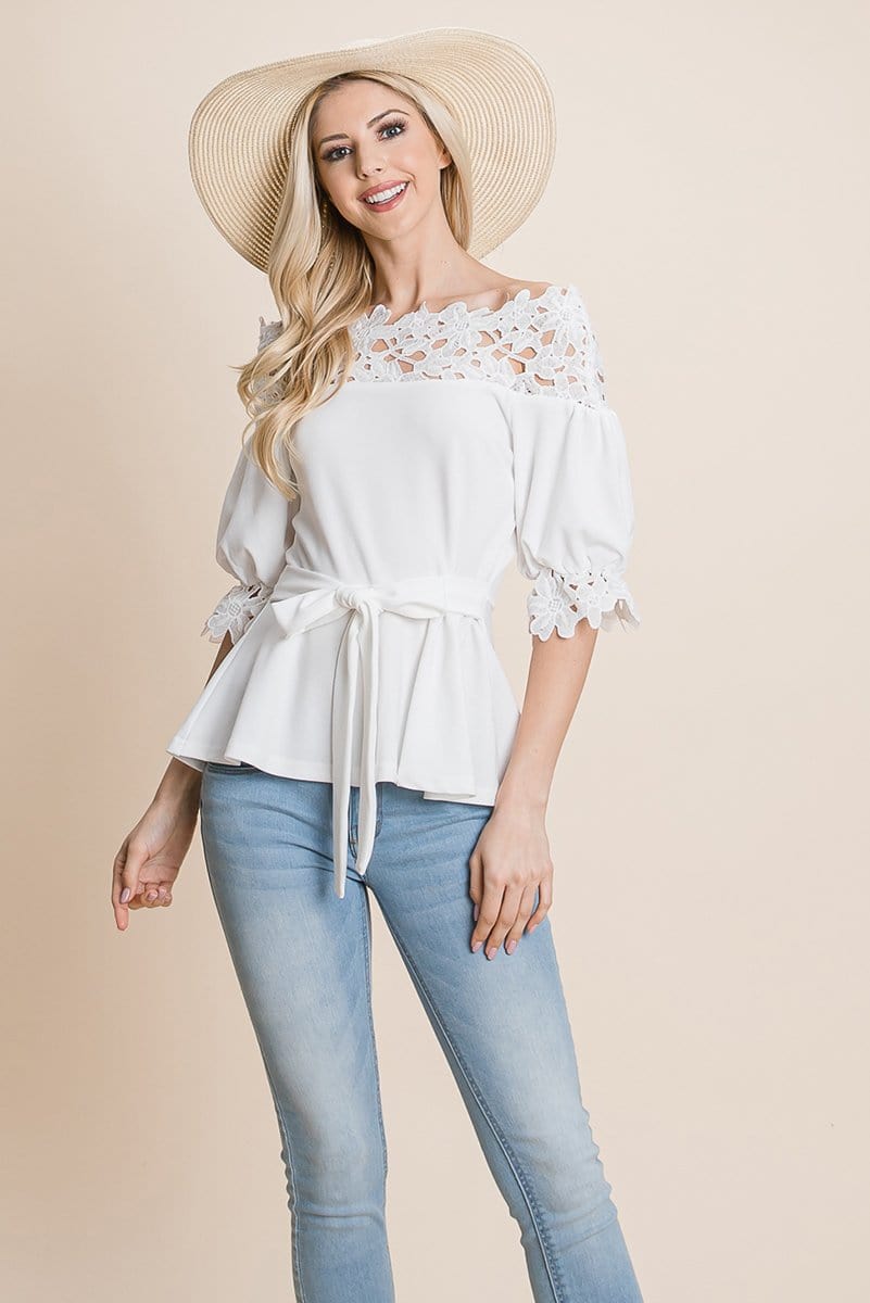 A stylish Lace Crochet Self Belted Off The Shoulder Top featuring floral lace applique, half lace trim sleeves, and a hidden back zipper.