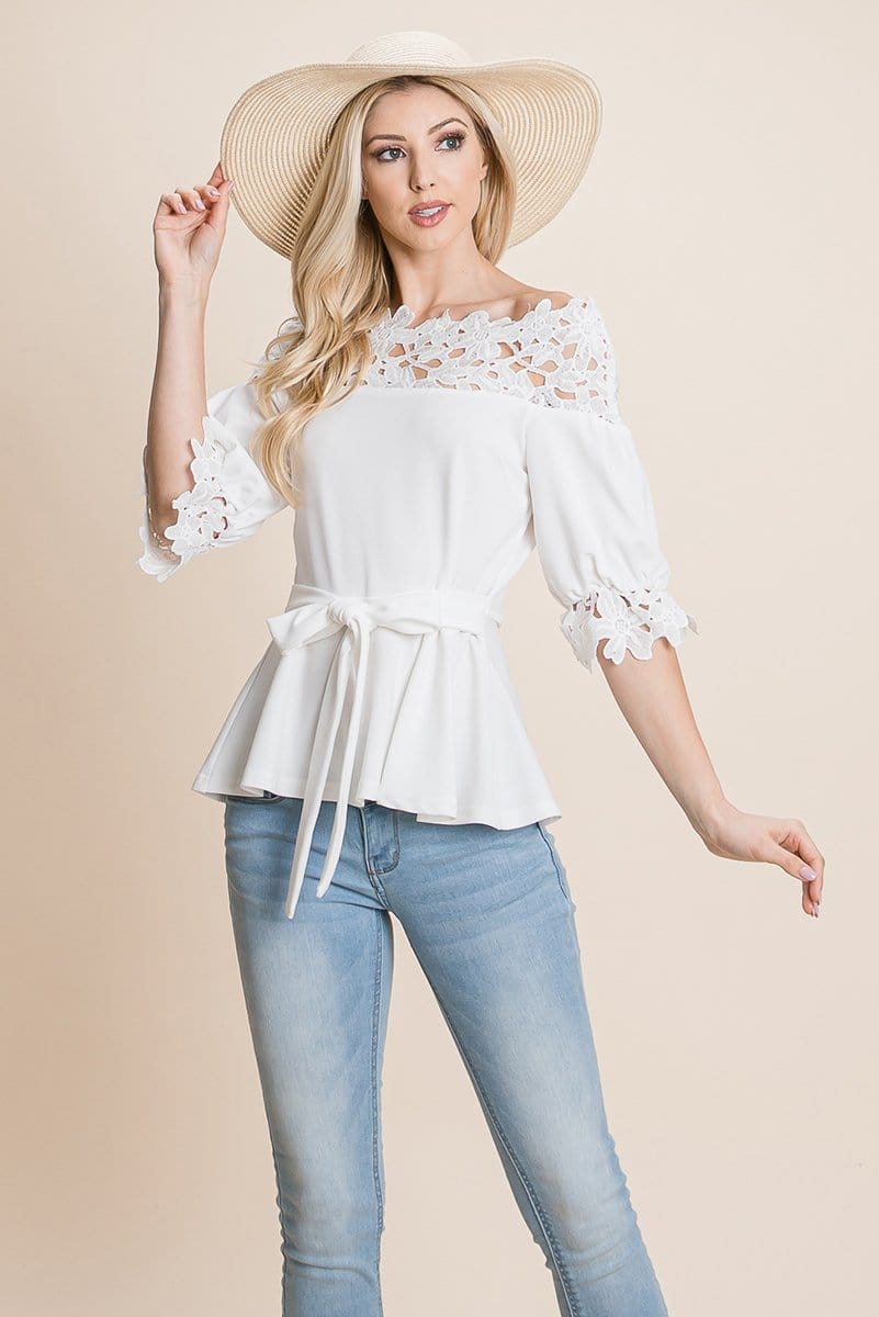 A stylish Lace Crochet Self Belted Off The Shoulder Top featuring floral lace applique, half lace trim sleeves, and a hidden back zipper.