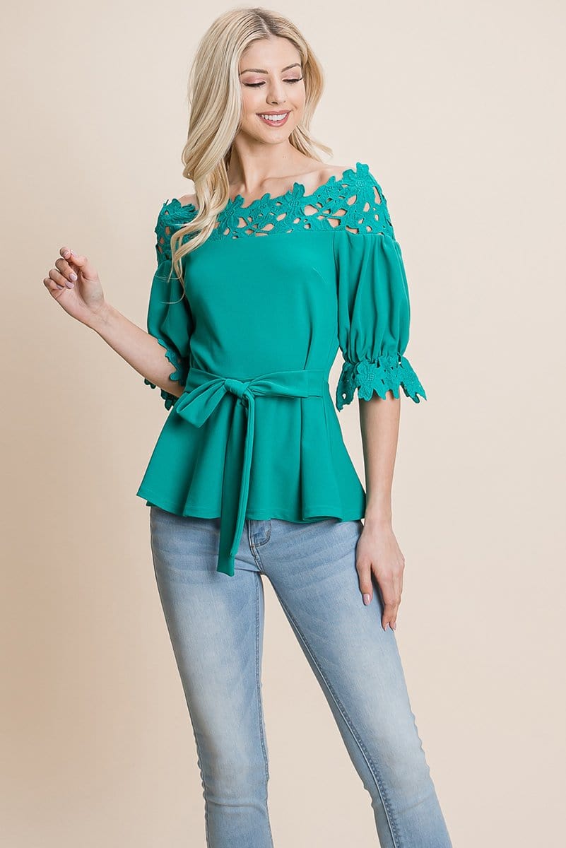 A stylish Lace Crochet Self Belted Off The Shoulder Top featuring floral lace applique, half lace trim sleeves, and a hidden back zipper.