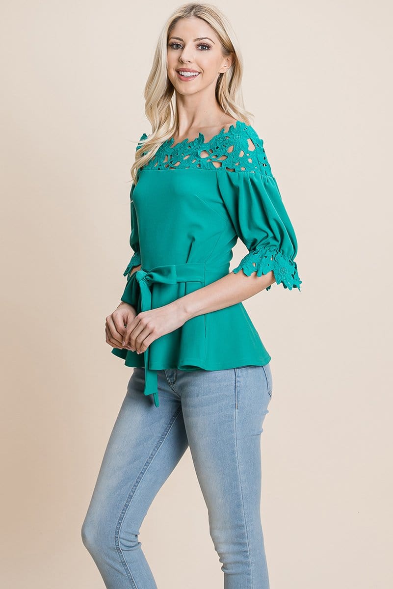 A stylish Lace Crochet Self Belted Off The Shoulder Top featuring floral lace applique, half lace trim sleeves, and a hidden back zipper.