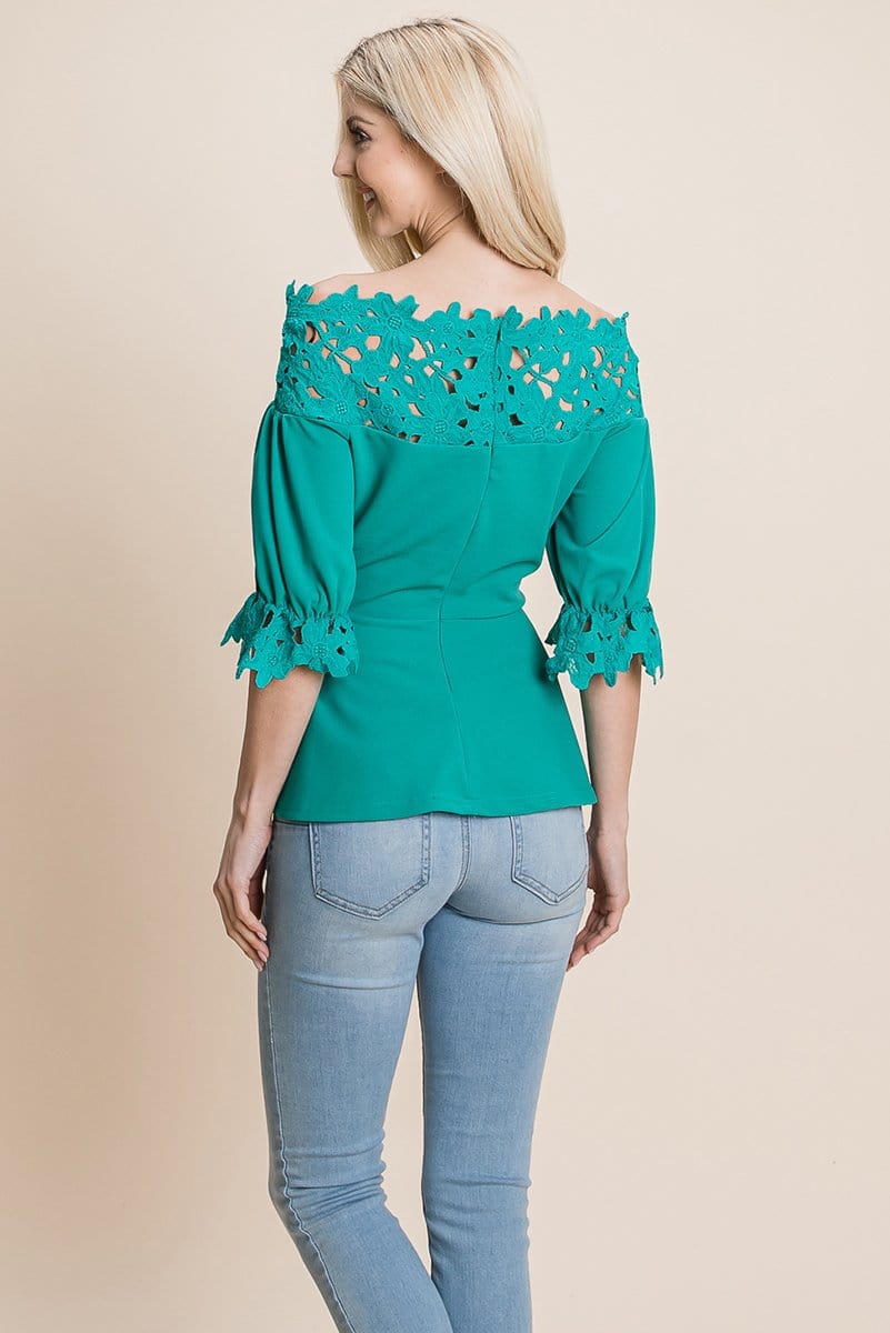 A stylish Lace Crochet Self Belted Off The Shoulder Top featuring floral lace applique, half lace trim sleeves, and a hidden back zipper.