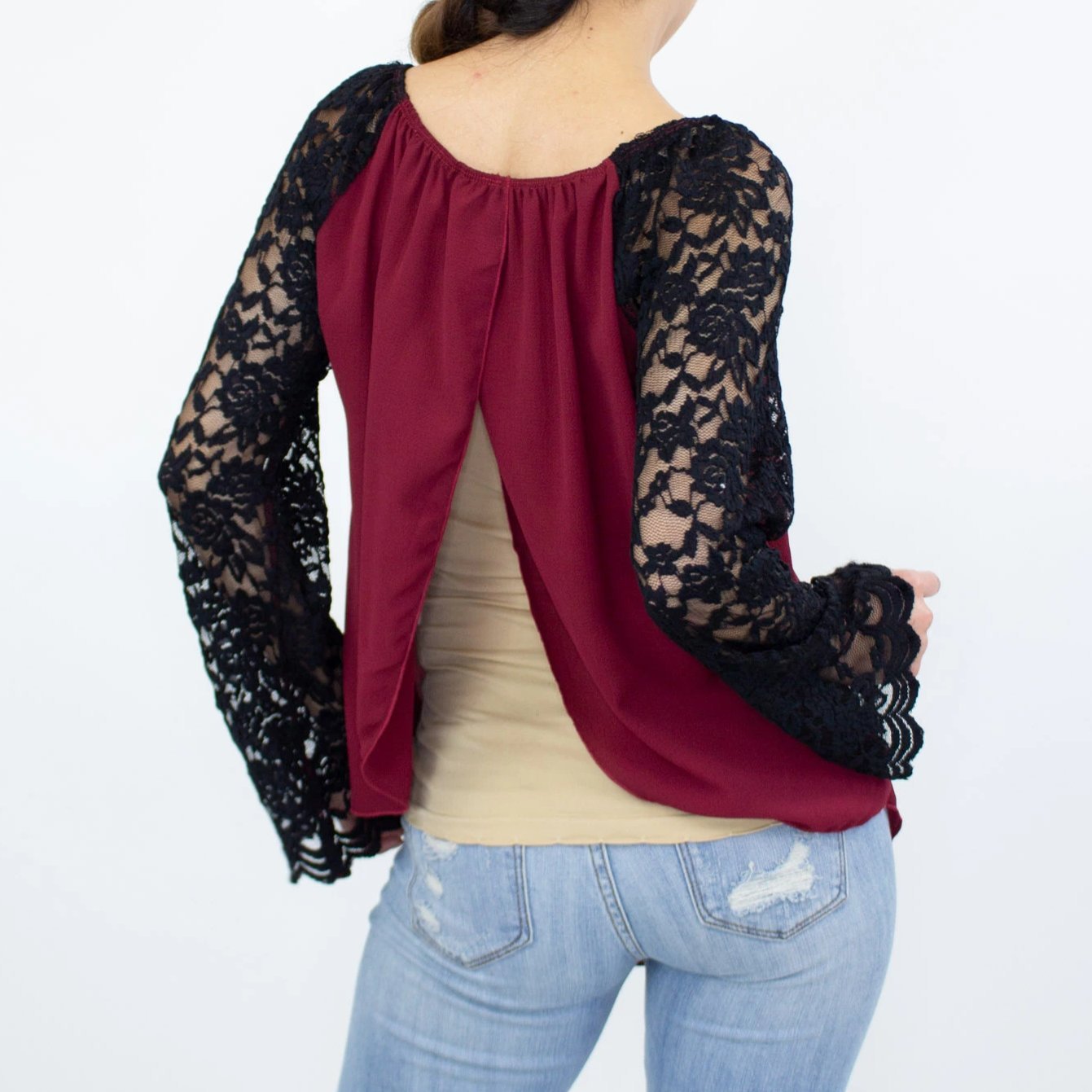 Burgundy Lace Sleeve Backless Top featuring elegant lace sleeves and a stylish back slit, perfect for casual and chic occasions.