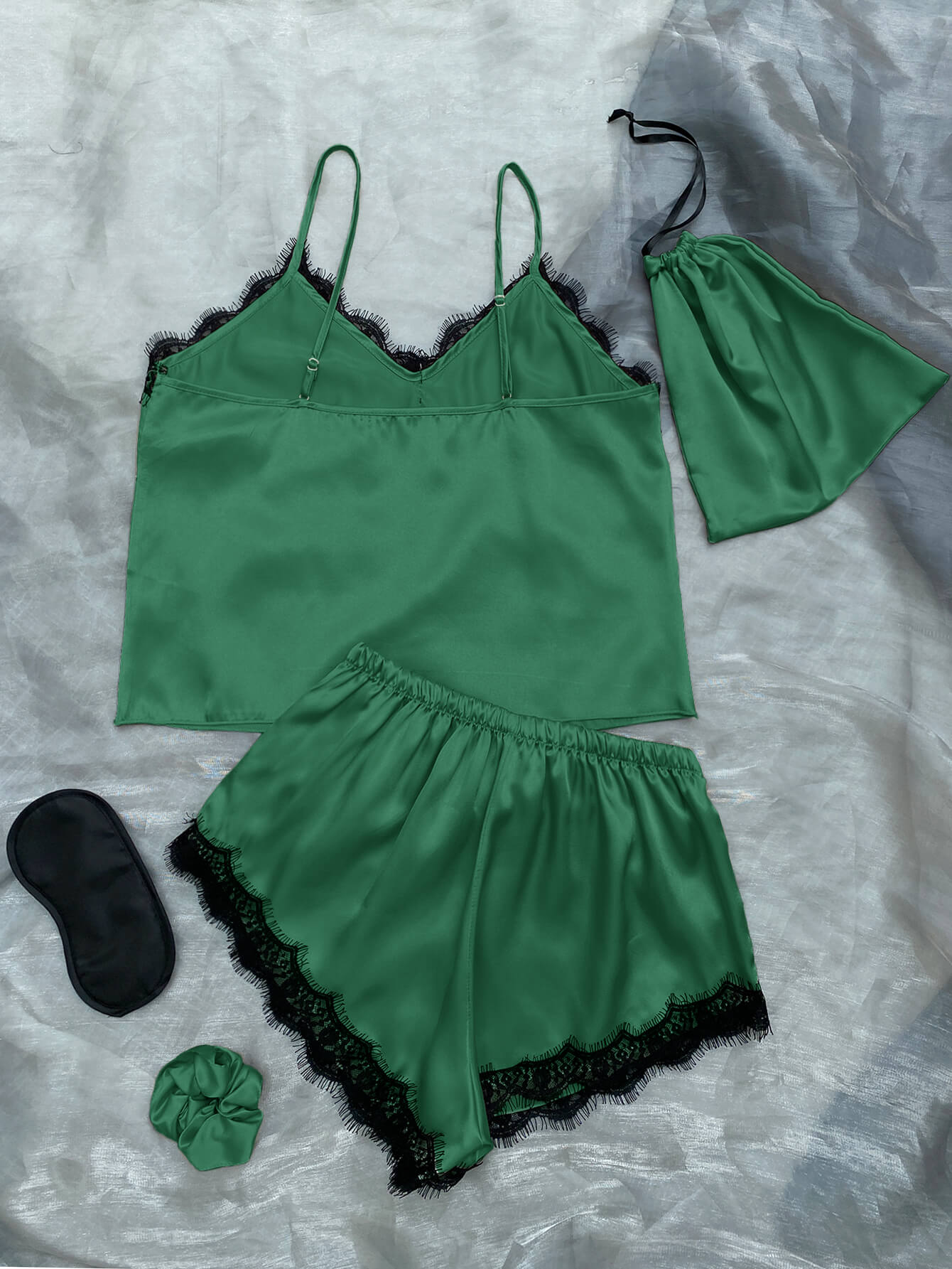 Lace Trim Cami, Shorts, Eye Mask, Scrunchie, and Bag Pajama Set displayed in a flat lay style, showcasing the elegant satin fabric and lace details.