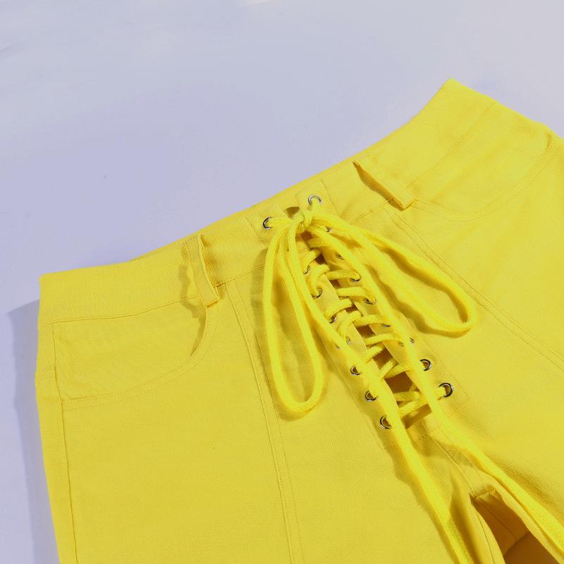 A pair of sexy yellow lace-up bodycon long pants, featuring a high waist and ankle-length design, perfect for autumn and winter fashion.