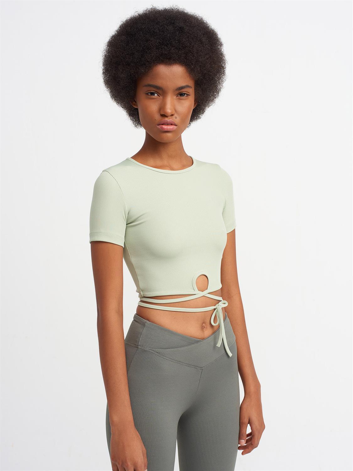 A stylish Lace Up Crop Top featuring a chic lace-up front design, made from a comfortable nylon-elastane blend.