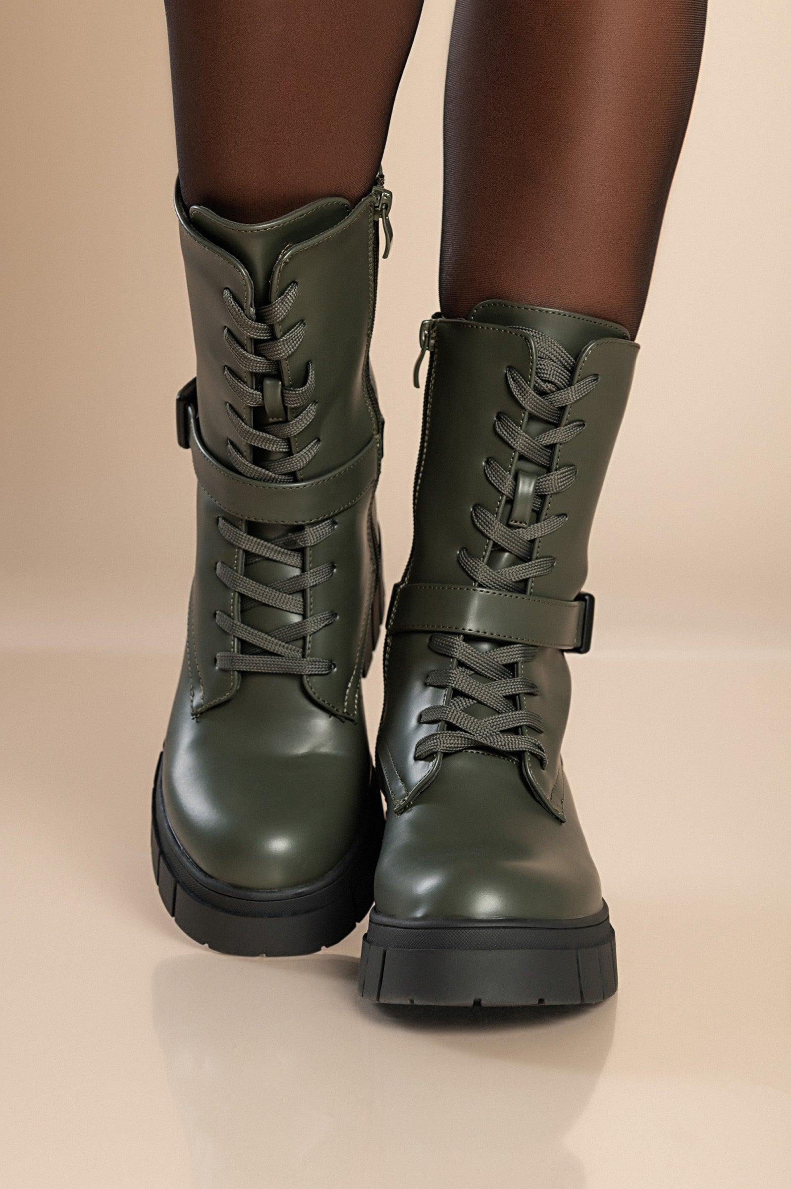 Stylish green lace-up ankle boots with round toe and zipper closure, made of high-quality synthetic leather.