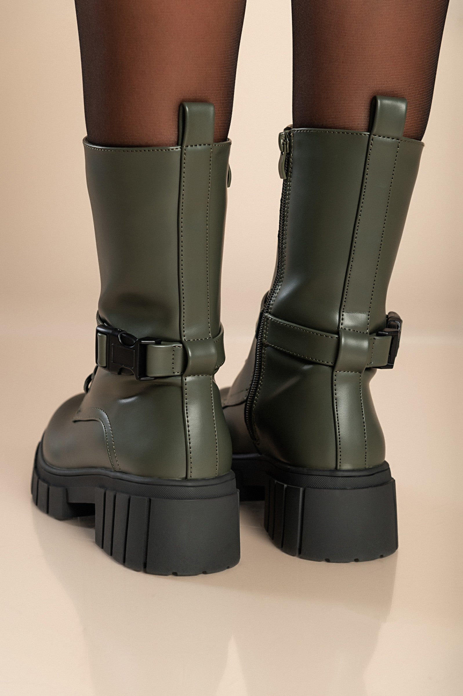 Stylish green lace-up ankle boots with round toe and zipper closure, made of high-quality synthetic leather.