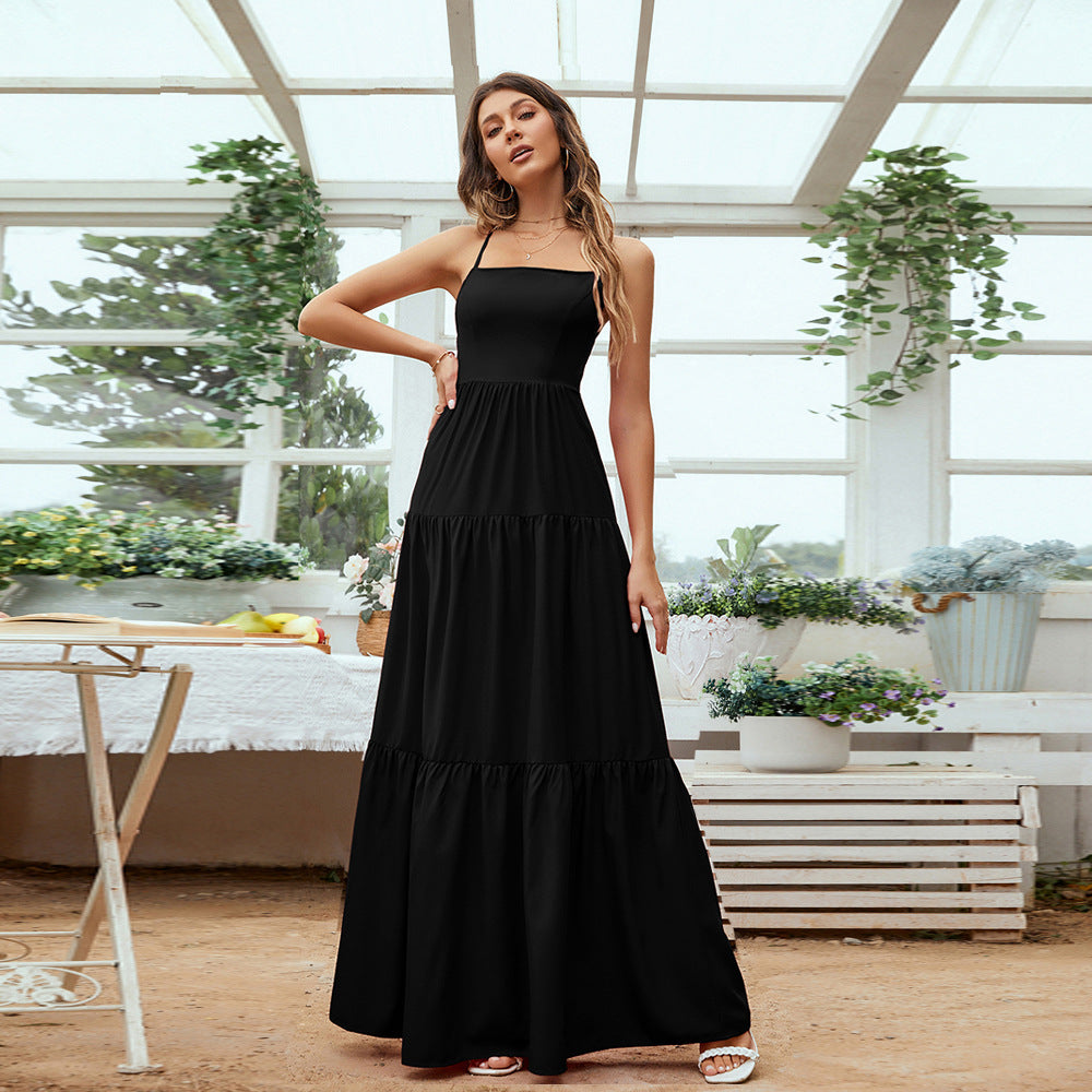 A beautiful Lace-Up Tiered Maxi Dress featuring a sleeveless design, tiered layers, and a backless style, perfect for formal occasions.