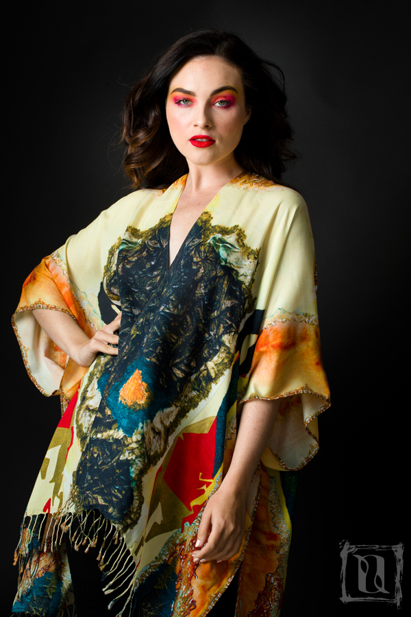 A stylish 'Lady in Peridome' Kimono made from 100% Modal, featuring a rich green color and flowing design, suitable for various occasions.