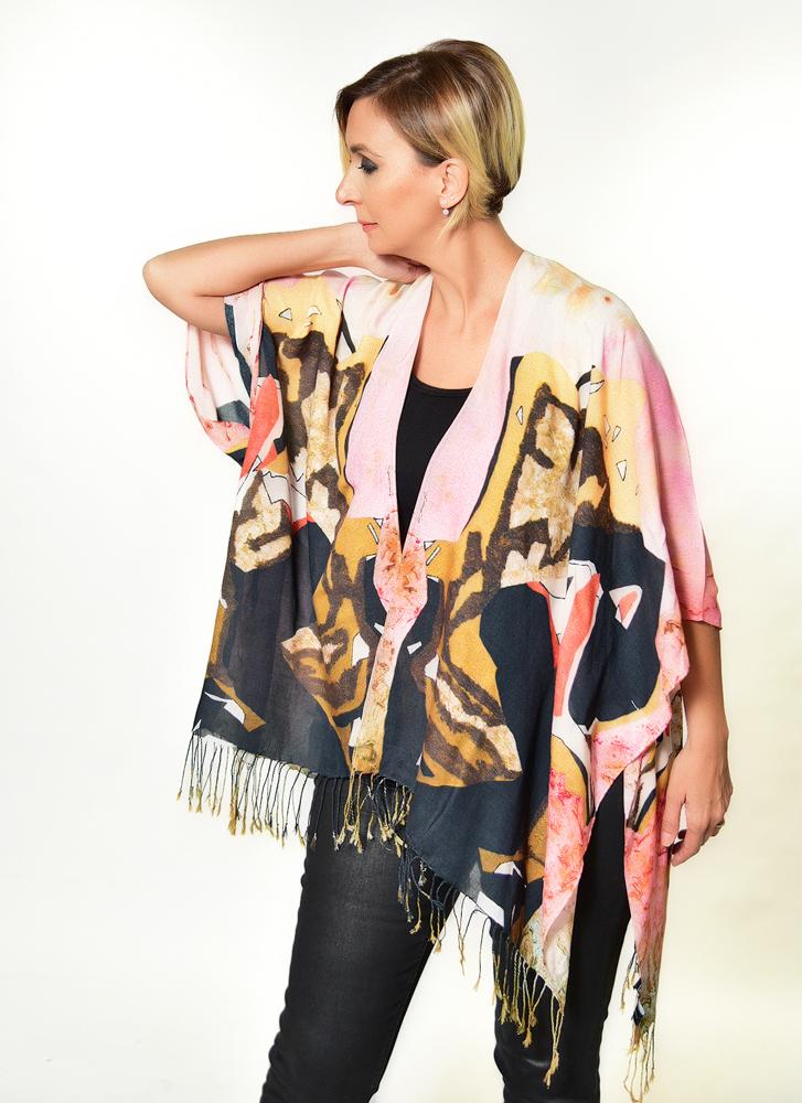 A luxurious 'Lady in the Golden Chair' Kimono made from soft 100% Modal fabric, featuring a flowing design suitable for various styling options.