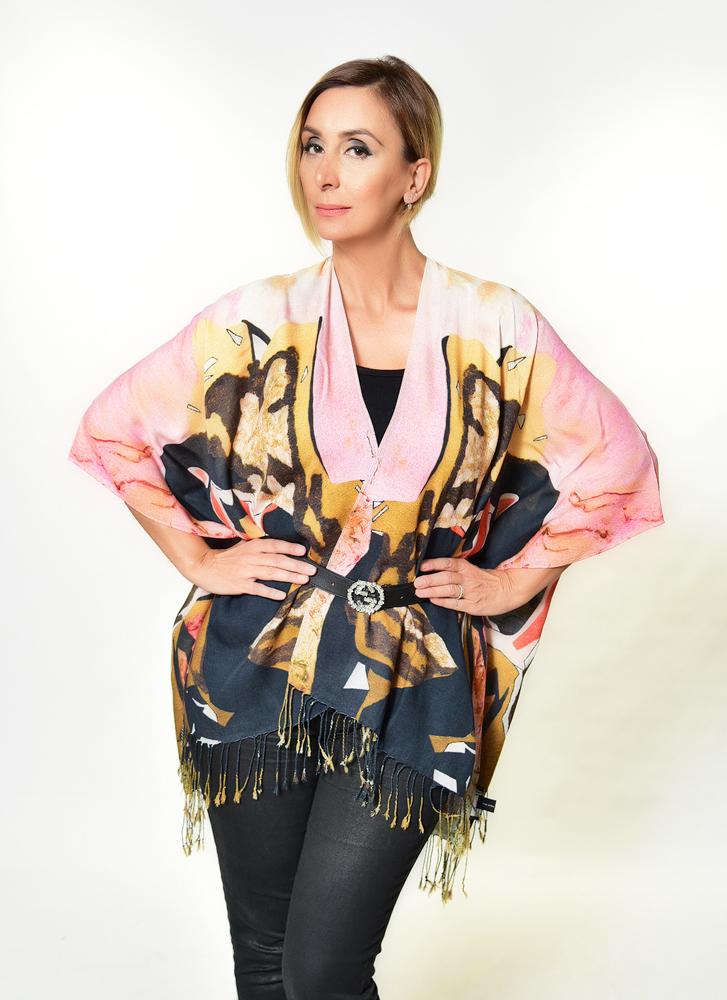 A luxurious 'Lady in the Golden Chair' Kimono made from soft 100% Modal fabric, featuring a flowing design suitable for various styling options.