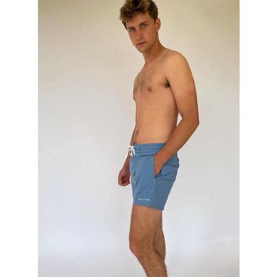 Laguna Shorts in blue, made from recycled ocean plastic, featuring three pockets and a comfortable fit.