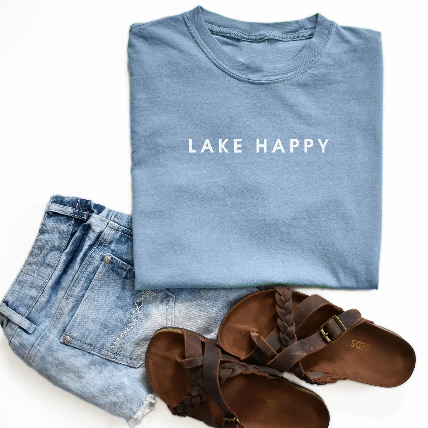 Lake Happy Tee featuring a vibrant design, unisex fit, and high-quality print, perfect for outdoor enthusiasts.