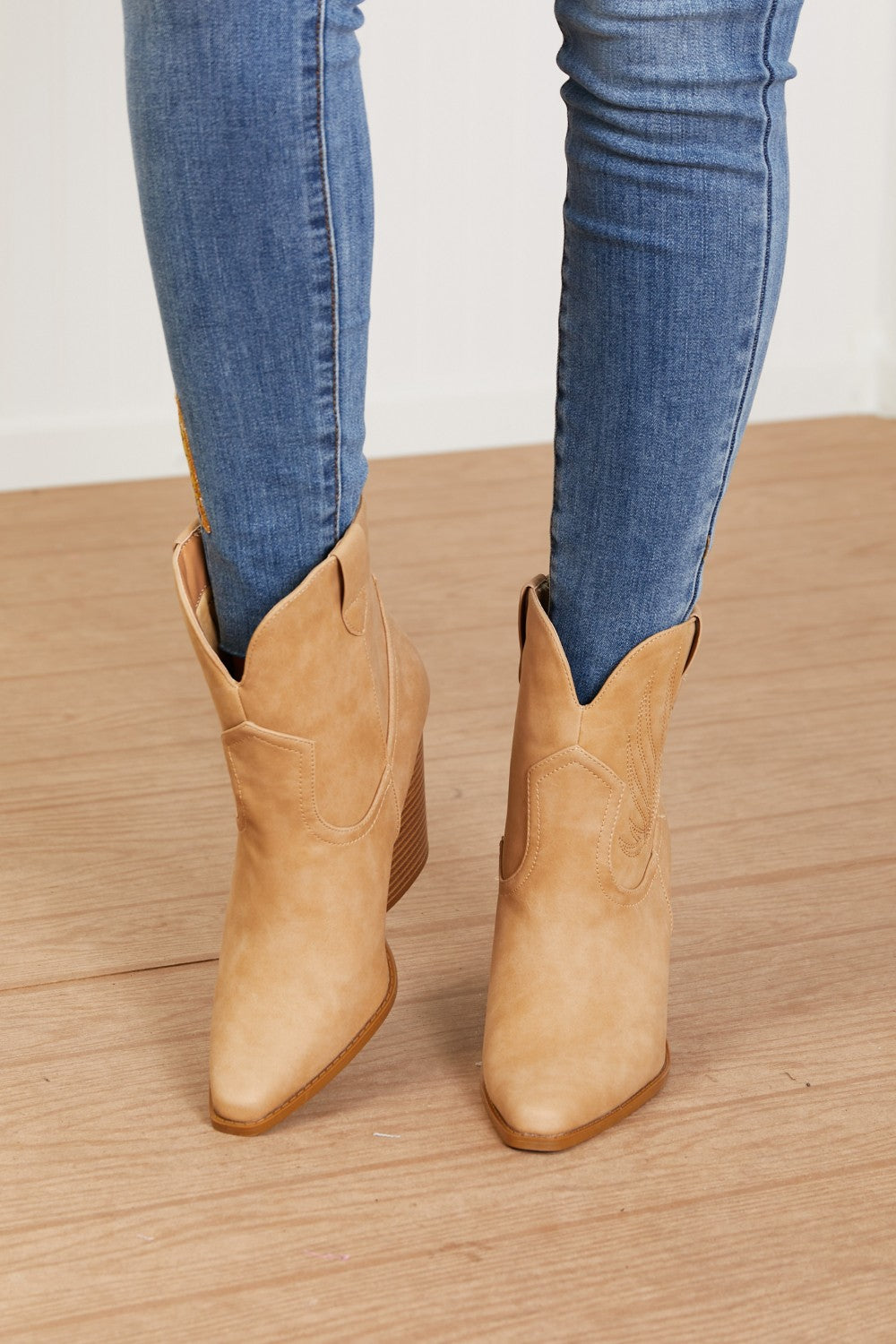 Lasso My Heart Cowboy Booties featuring a classic Western design with point toe and block heels in soft nubuck material.