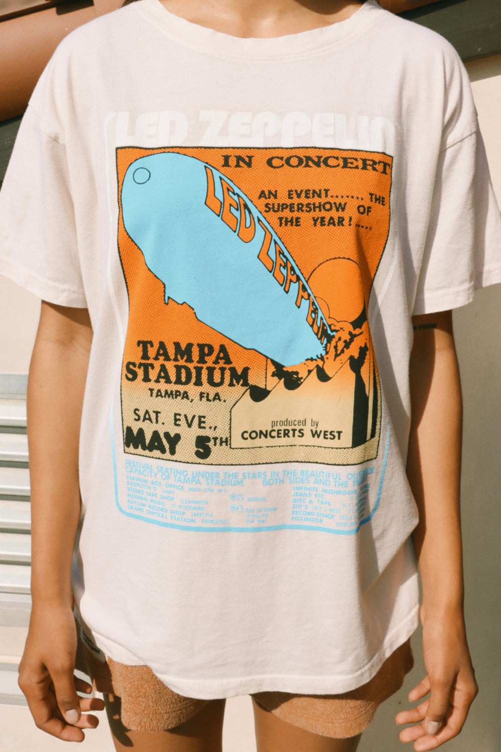 Led Zeppelin Tampa Stadium Boyfriend Tee in ivory color, showcasing a relaxed fit and vintage style, perfect for summer wear.