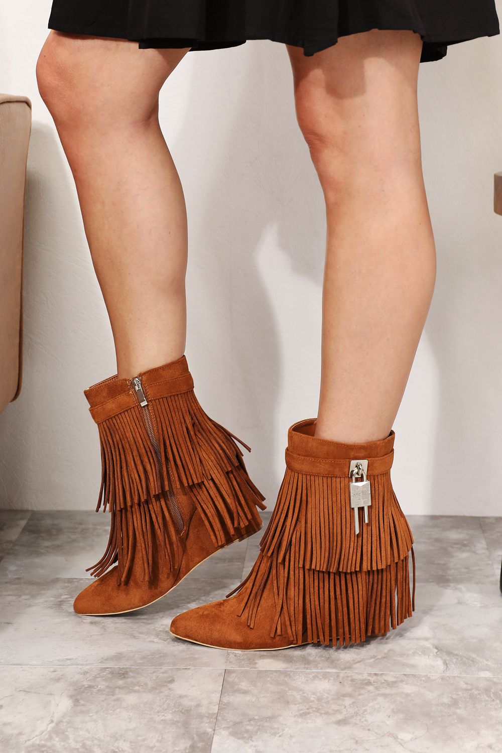 Legend Women's Tassel Wedge Heel Ankle Booties featuring an open shank design, pointy toe, and stylish tassels in premium vegan suede.