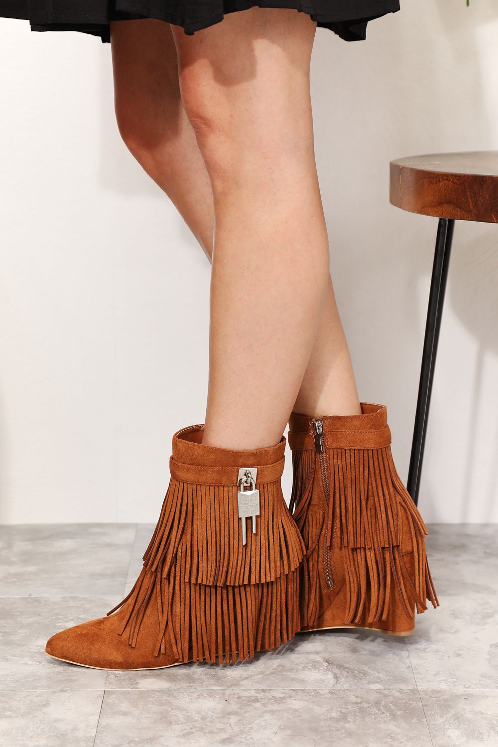 Legend Women's Tassel Wedge Heel Ankle Booties featuring an open shank design, pointy toe, and stylish tassels in premium vegan suede.