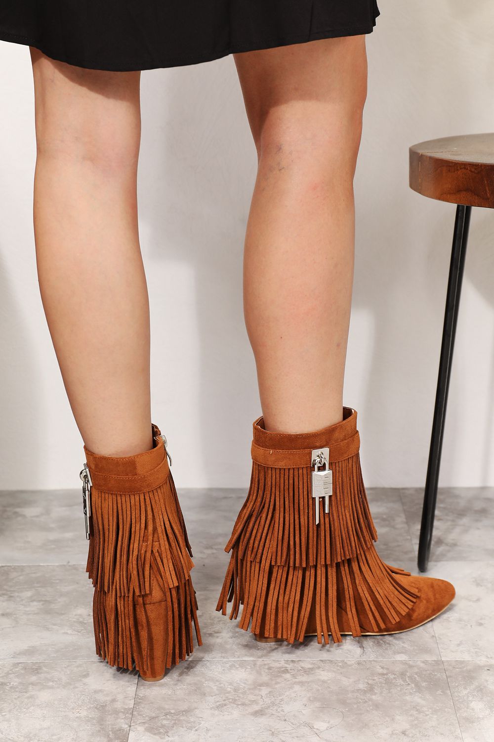 Legend Women's Tassel Wedge Heel Ankle Booties featuring an open shank design, pointy toe, and stylish tassels in premium vegan suede.