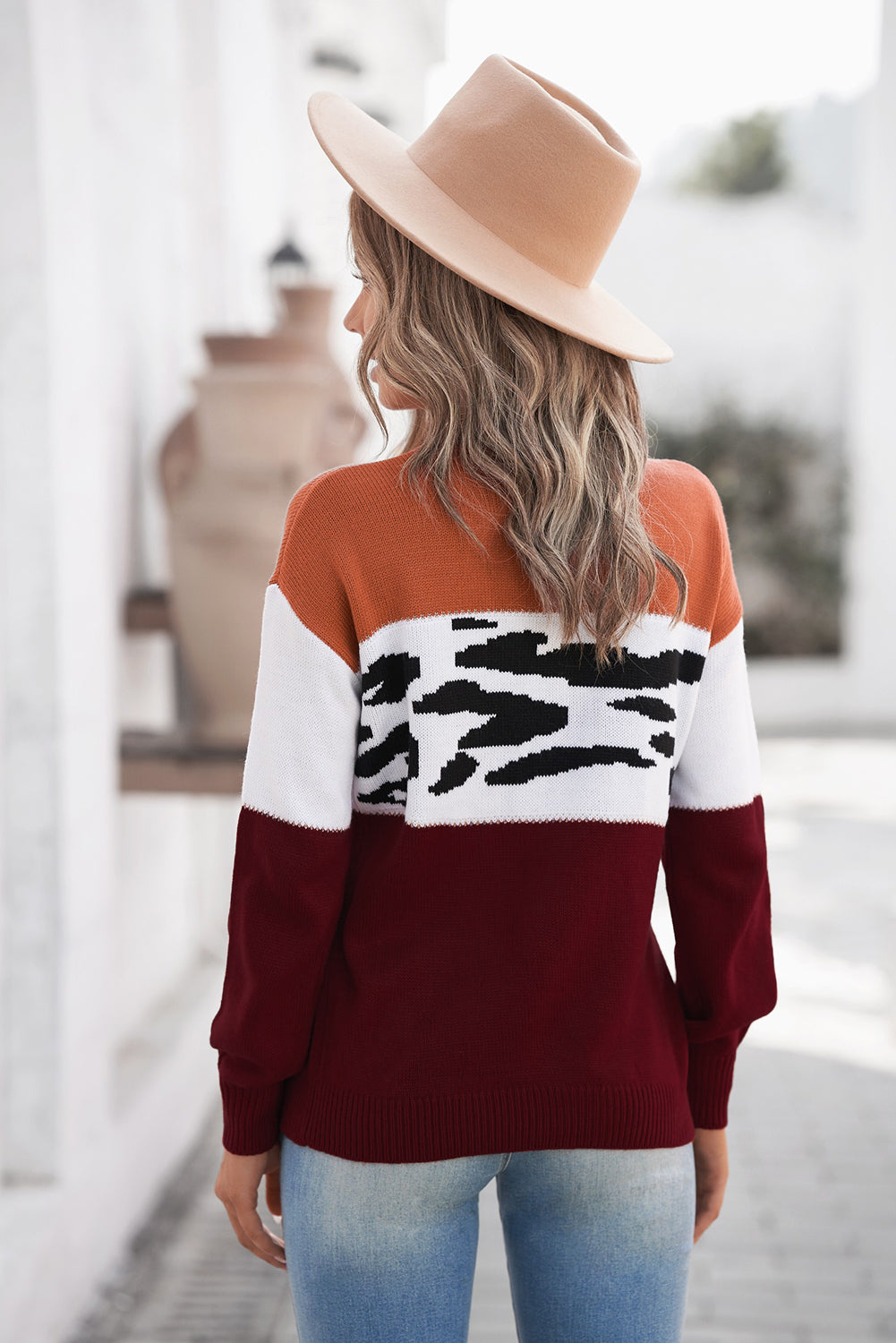 Leopard Color Block Ribbed Trim Dropped Shoulder Sweater displayed on a mannequin, showcasing its trendy animal print and casual style.