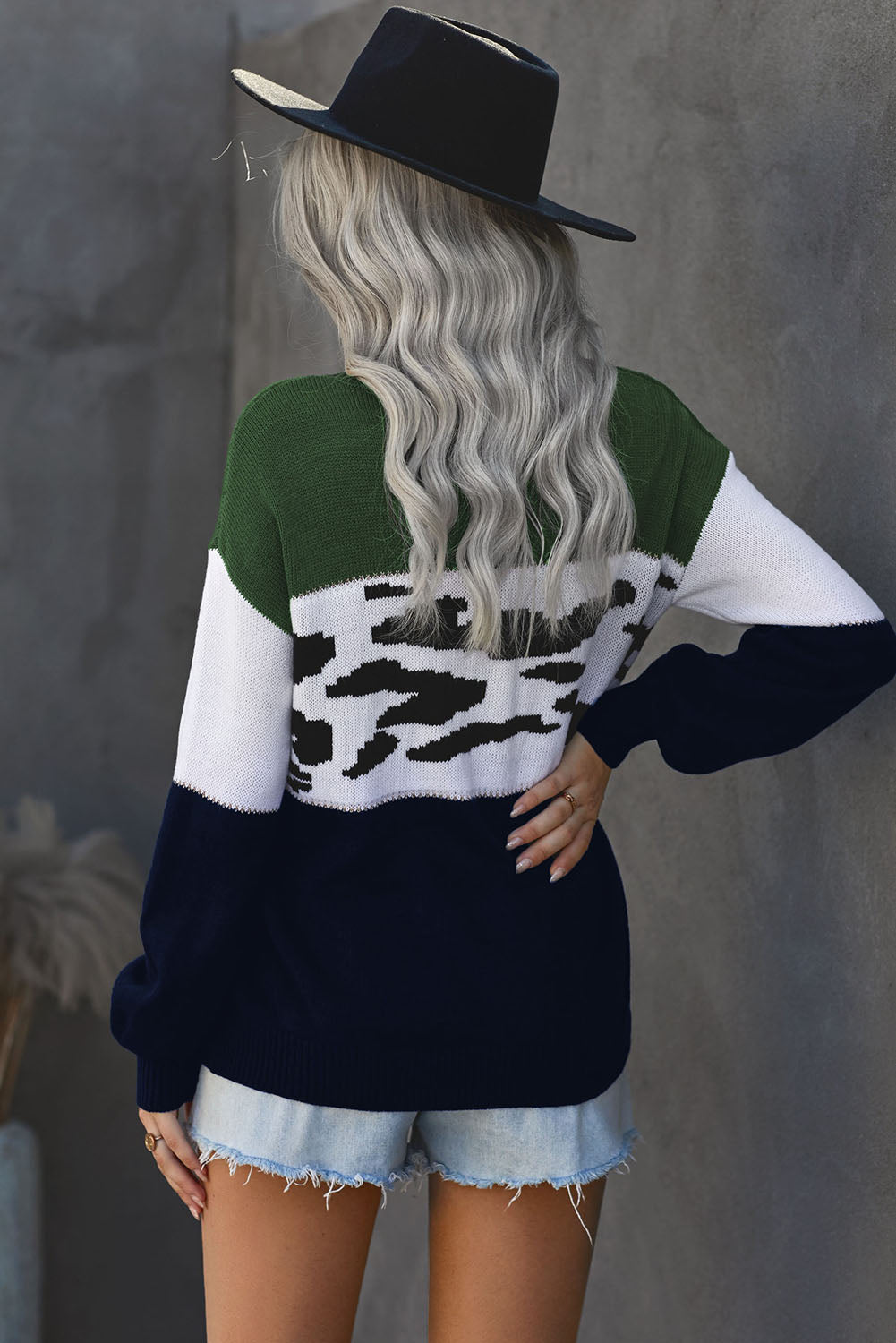 Leopard Color Block Ribbed Trim Dropped Shoulder Sweater displayed on a mannequin, showcasing its trendy animal print and casual style.