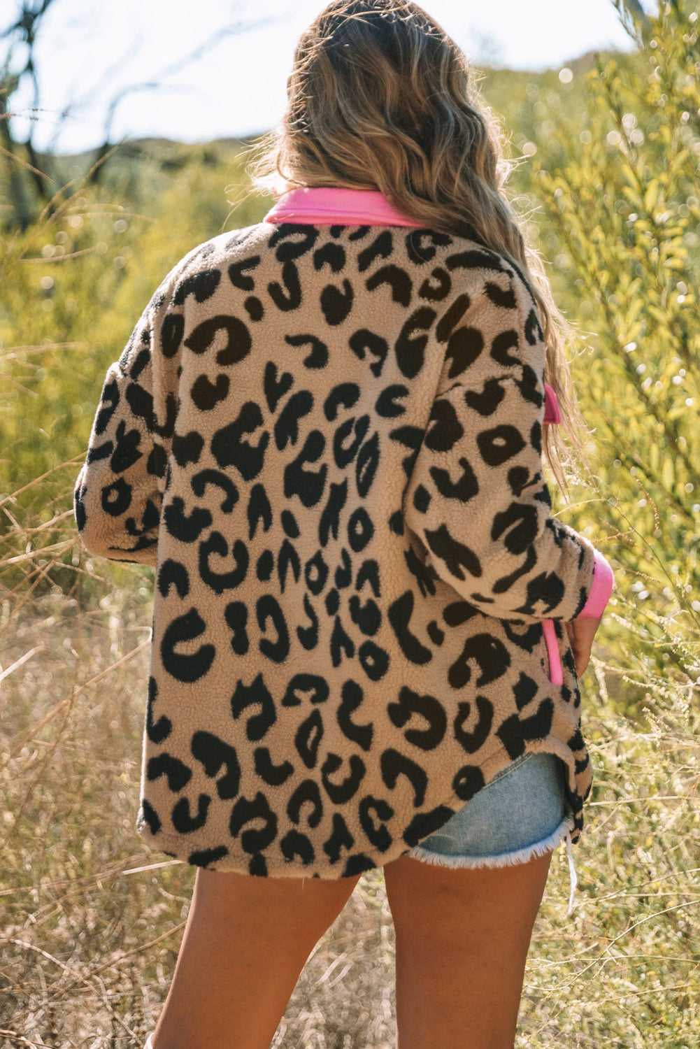 Leopard Contrast Teddy Shacket with Pockets displayed on a mannequin, showcasing its stylish design and casual appeal.