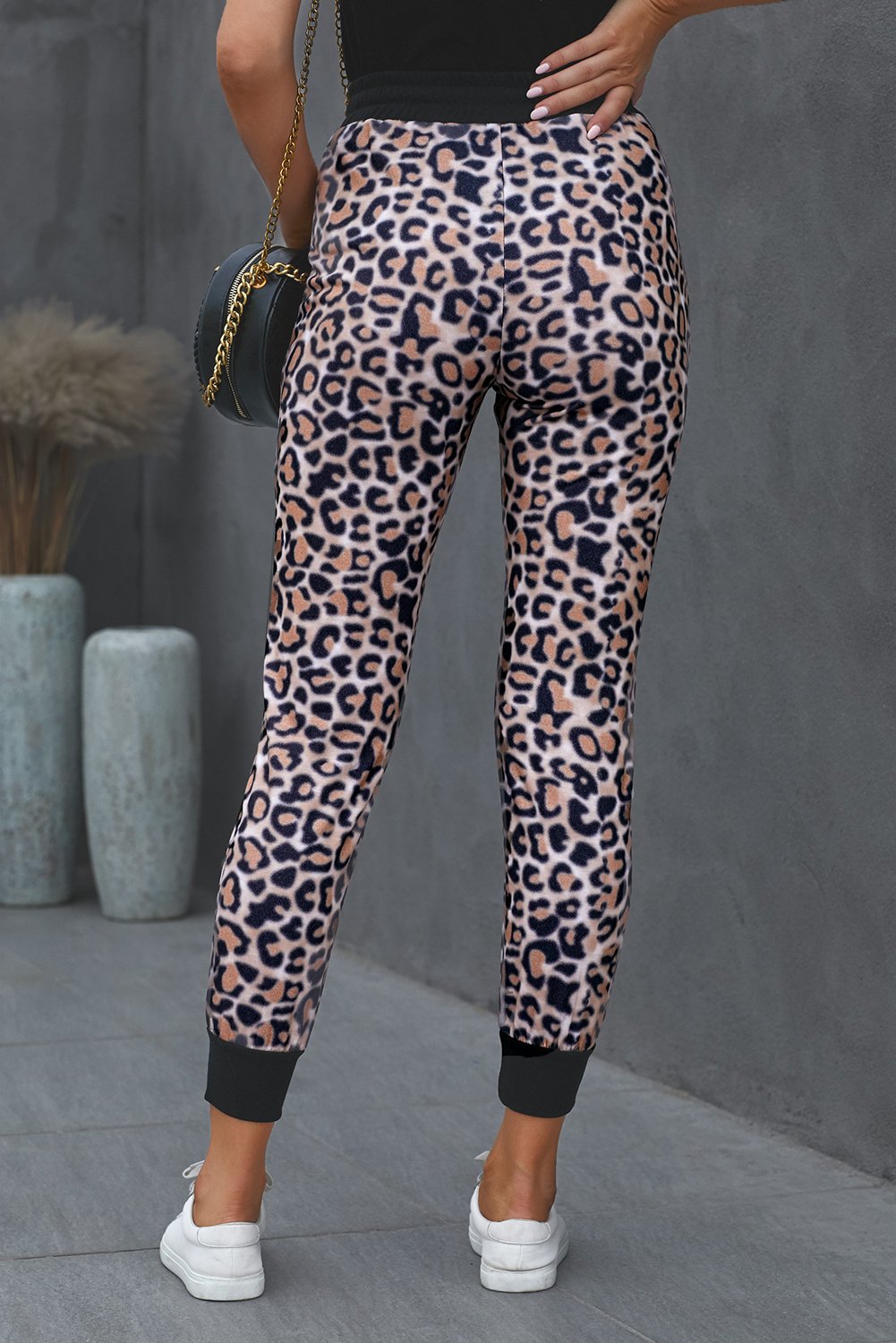 Leopard Cotton Pocketed Joggers featuring a trendy leopard print design, elastic waist, and side pockets for a stylish and comfortable fit.