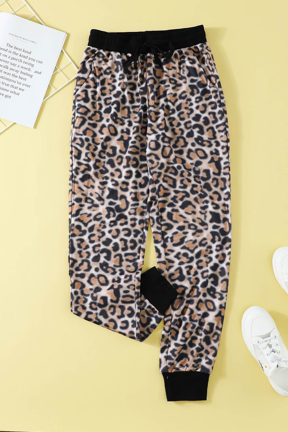 Leopard Cotton Pocketed Joggers featuring a trendy leopard print design, elastic waist, and side pockets for a stylish and comfortable fit.