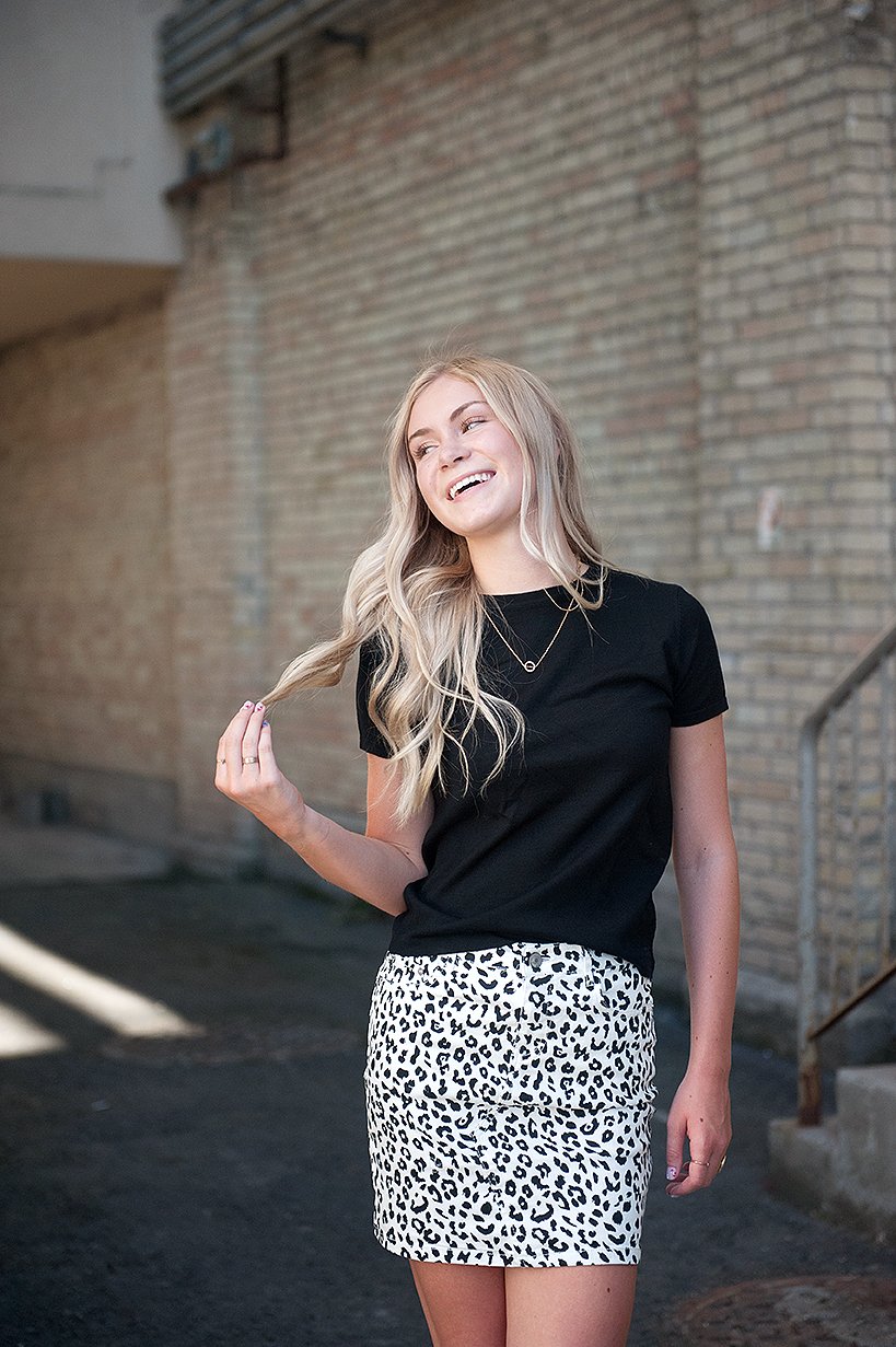 Black and white leopard mini skirt displayed on a mannequin, showcasing its stylish design and comfortable fit.