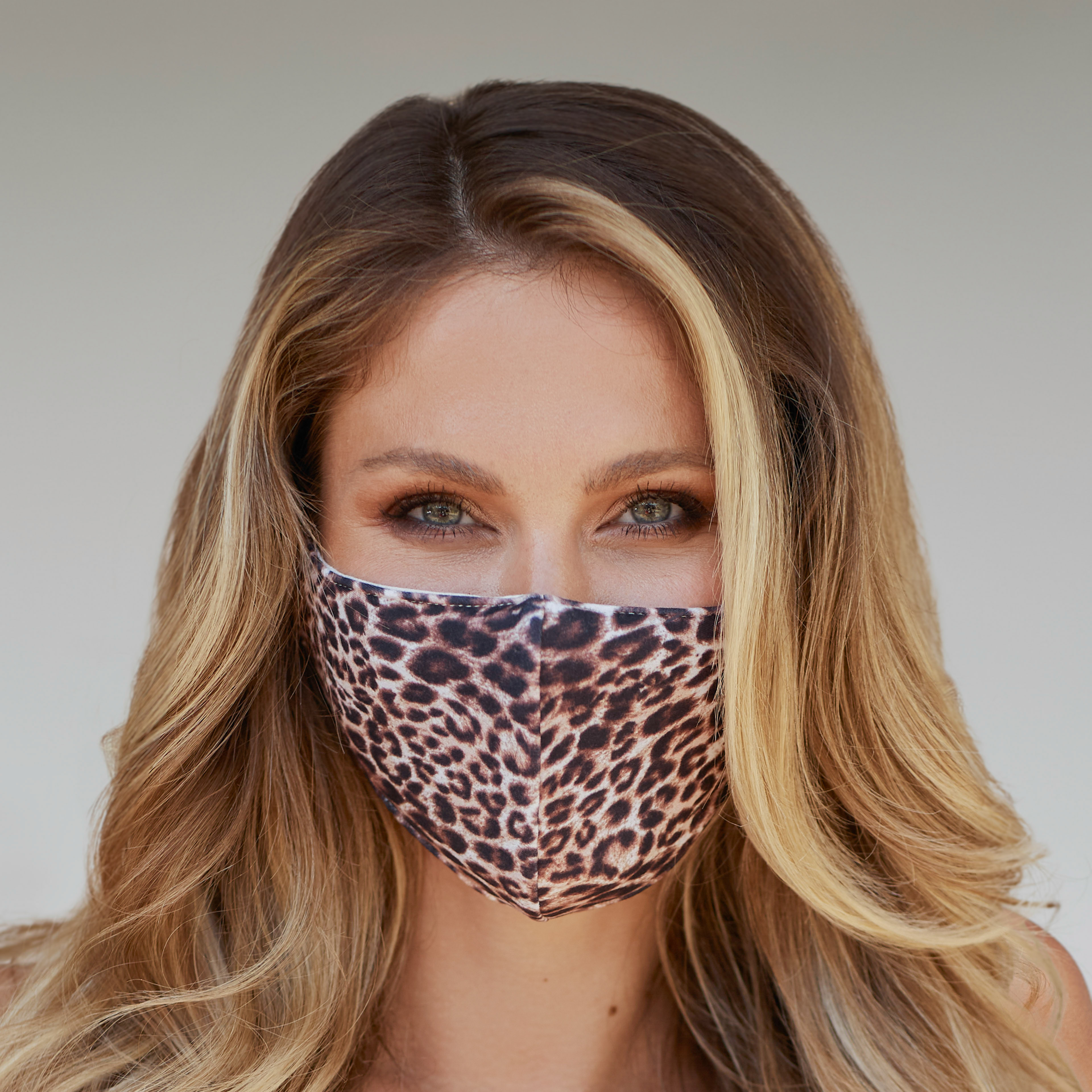 Leopard pattern face mask showcasing a stylish design, perfect for everyday use and outdoor activities.