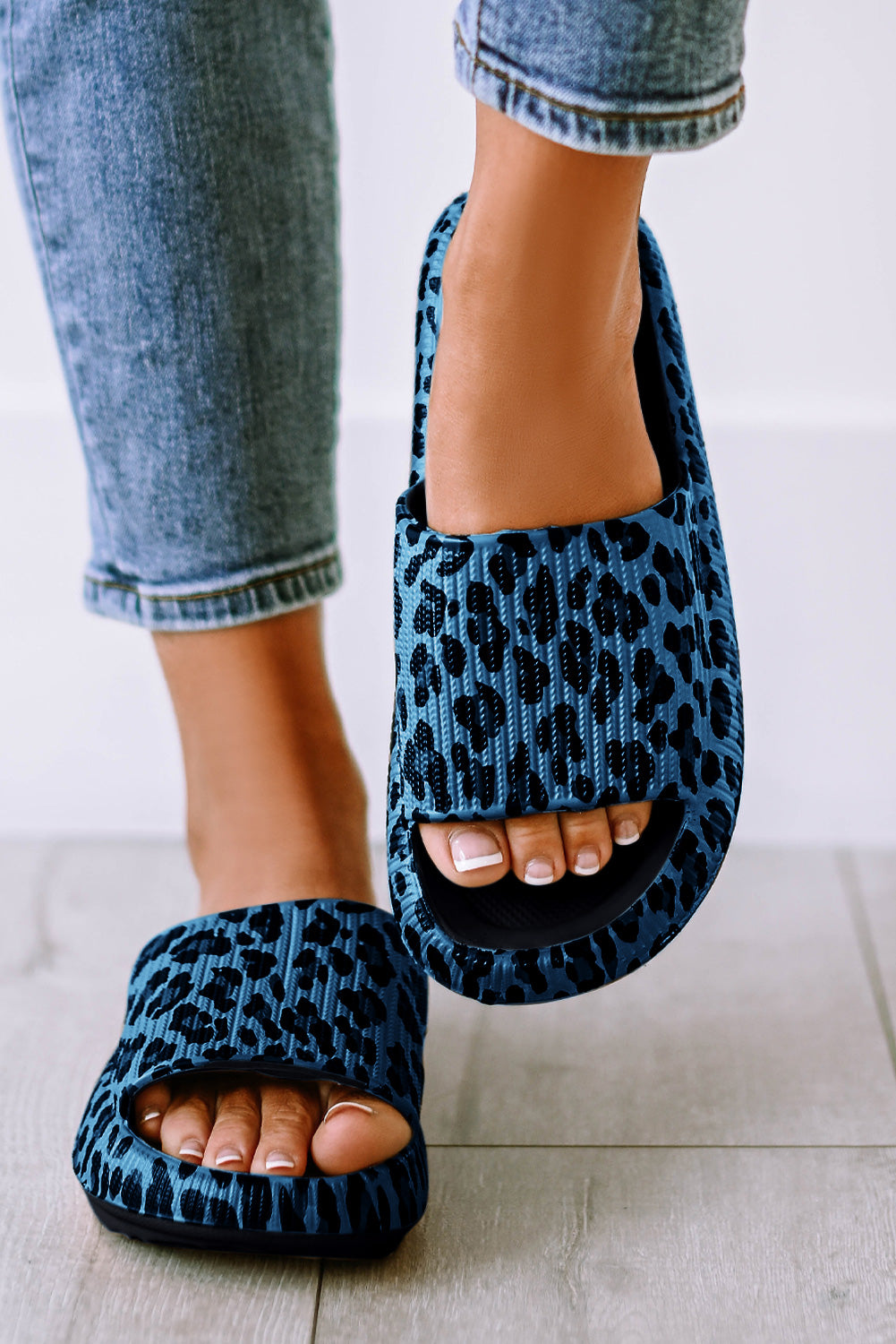 Leopard print thick sole slip on slippers showcasing stylish design and comfort features.