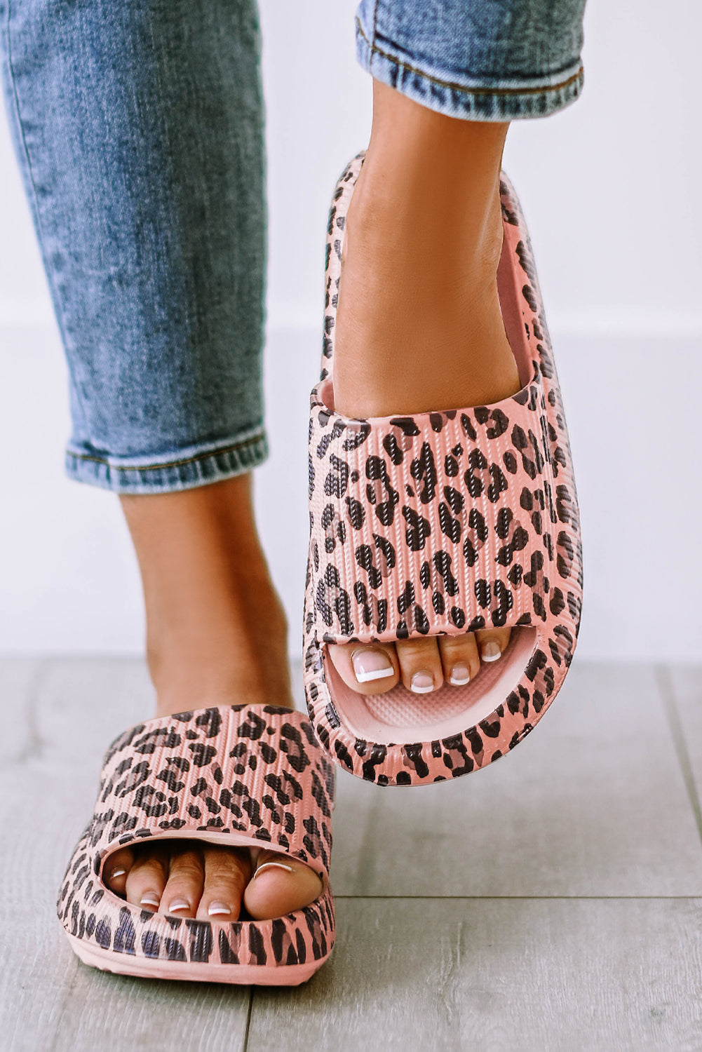 Leopard print thick sole slip on slippers showcasing stylish design and comfort features.