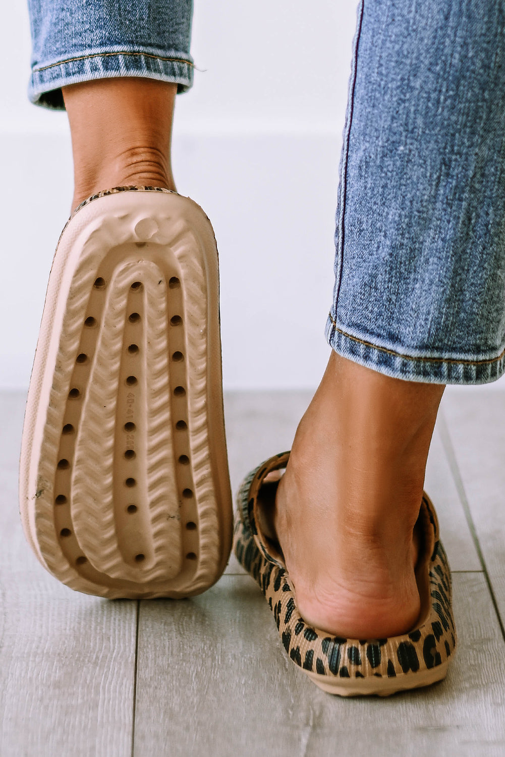 Leopard print thick sole slip on slippers showcasing stylish design and comfort features.