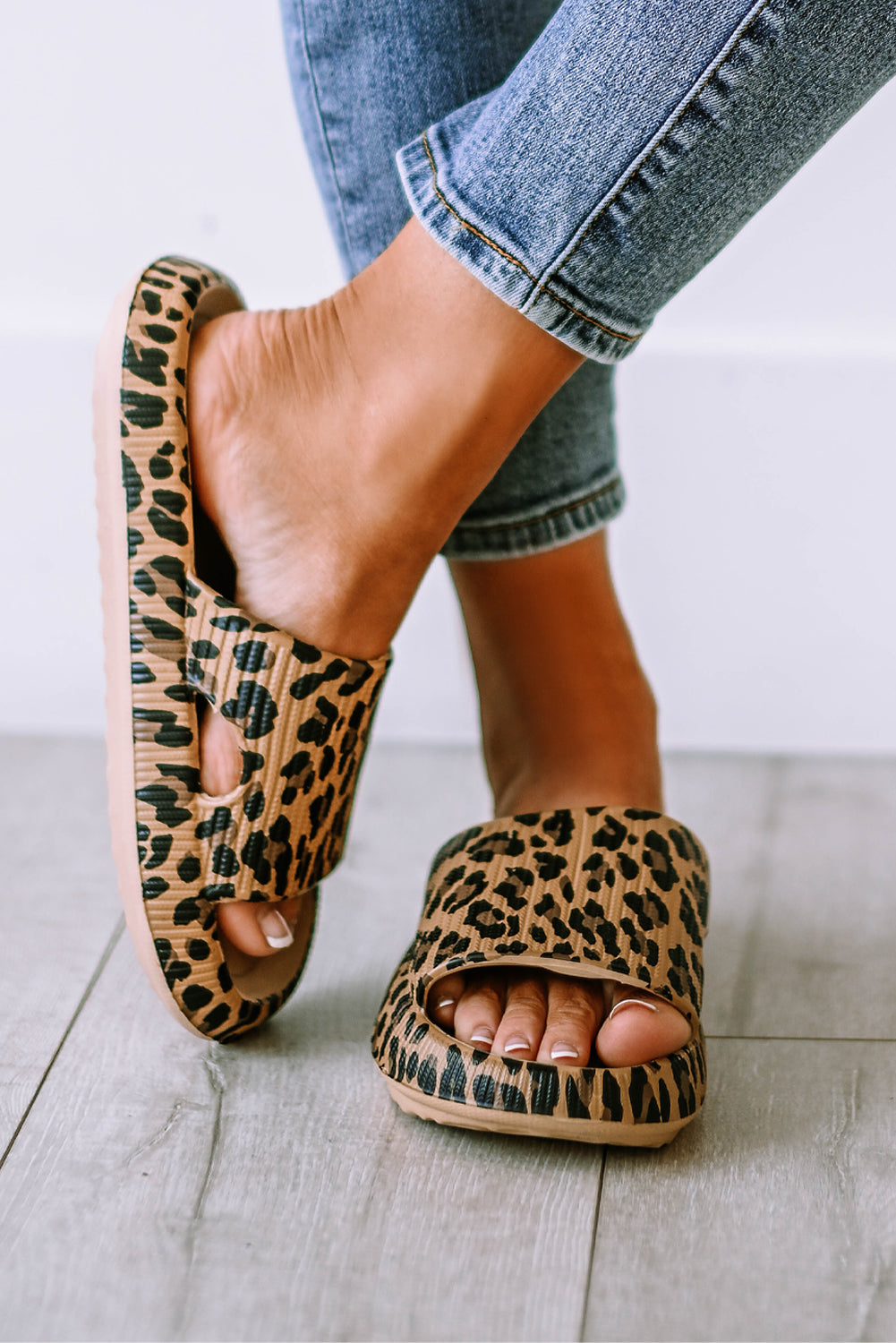 Leopard print thick sole slip on slippers showcasing stylish design and comfort features.