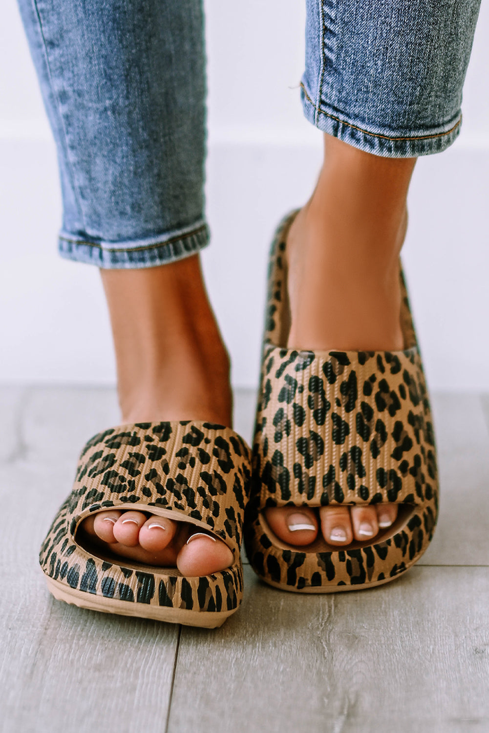 Leopard print thick sole slip on slippers showcasing stylish design and comfort features.