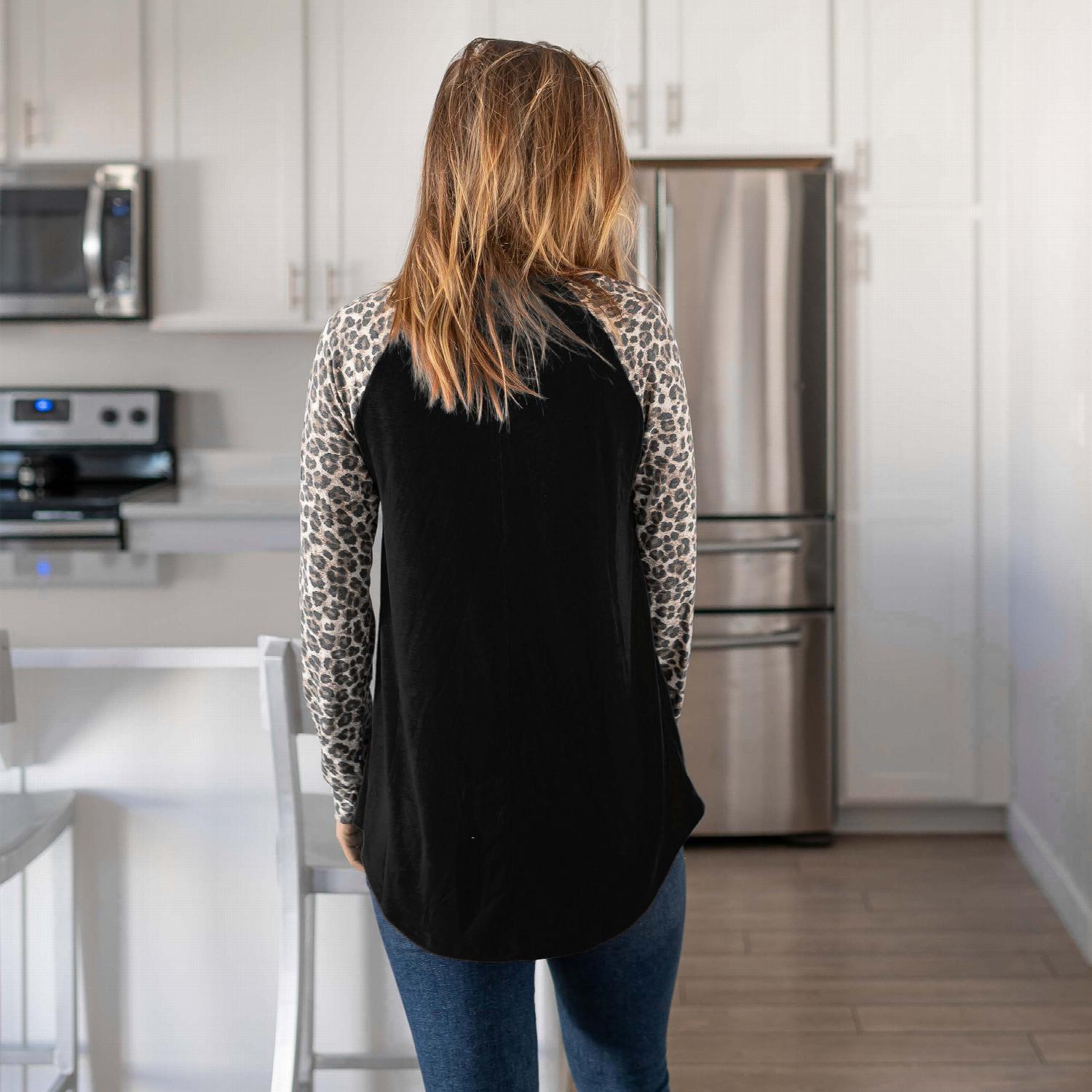 Leopard Raglan Sleeve Round Neck Top featuring bold cheetah-print long sleeves and a classic round neck design.